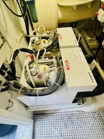 Engine room of 2006 Neptunus 55 Cabrio yacht with mechanical equipment.