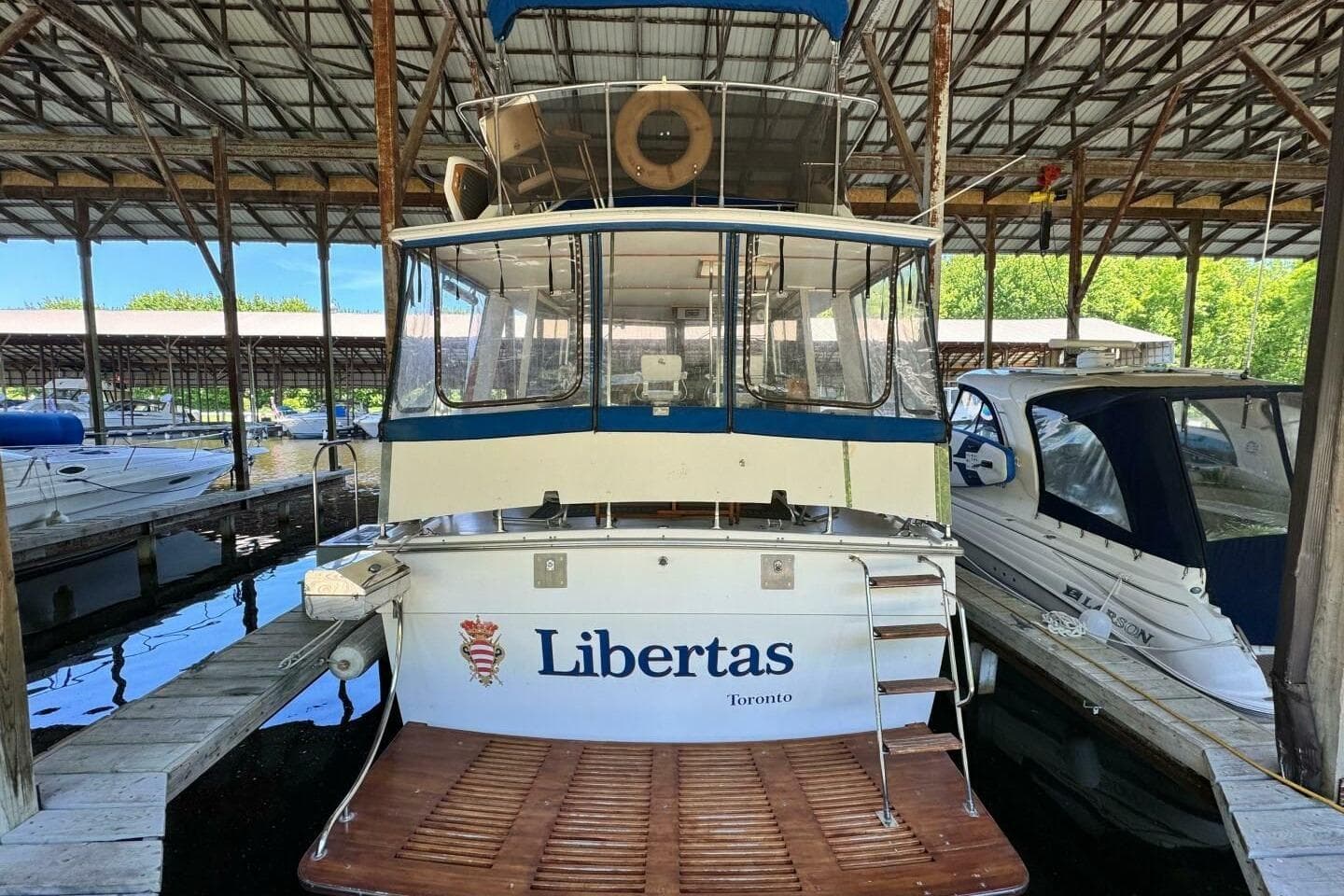 1977 Pacemaker FB Motor Yacht "Libertas" docked in a marina, Toronto.
