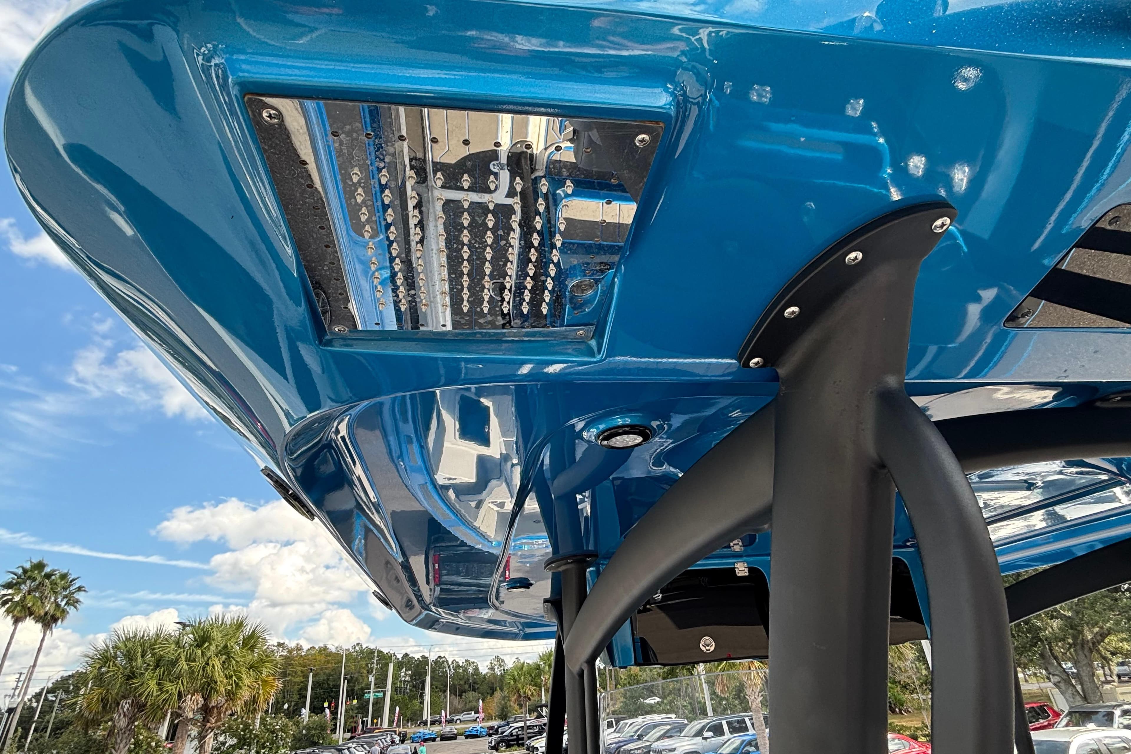 2024 GSX 36 boat underside view with blue hull and support structure.
