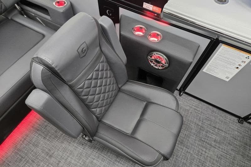 Luxurious seating in 2026 AquaPatio 235 DFL boat with modern design and ambient lighting.