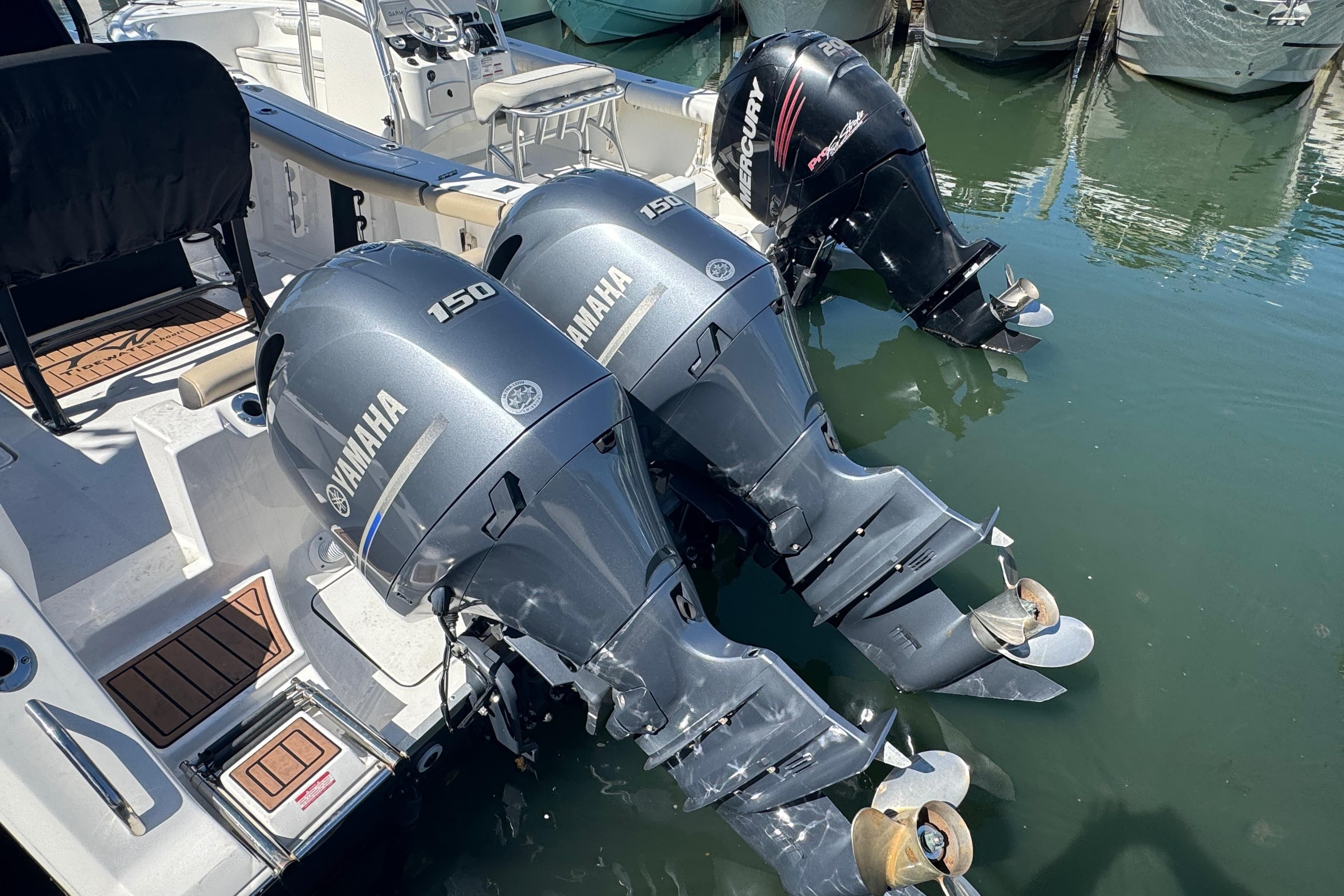 2022 Tidewater 256 CC Adventure boat with Yamaha and Mercury outboard engines.