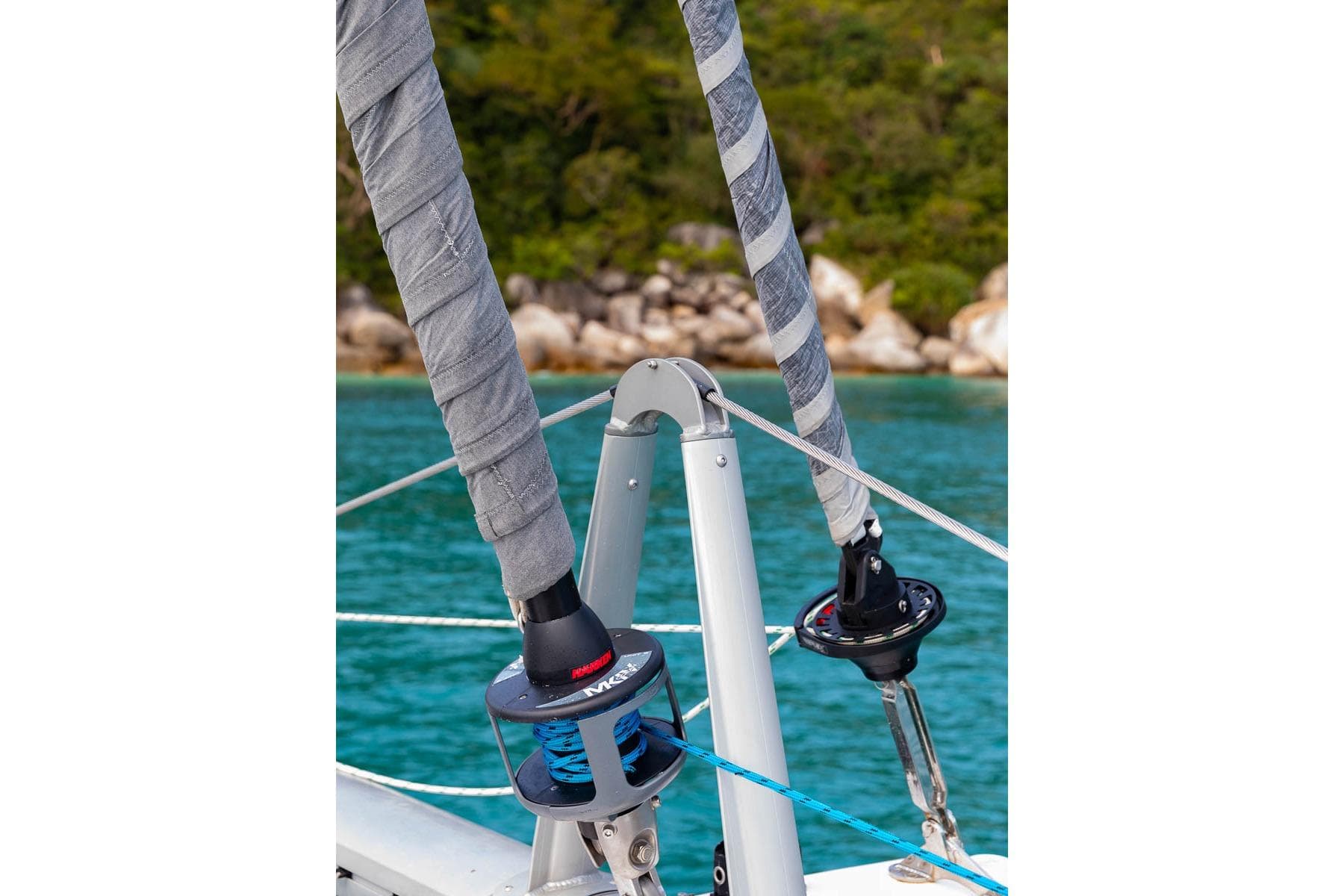Close-up of Seawind 1370 sailboat rigging, 2026 model, with turquoise water background.