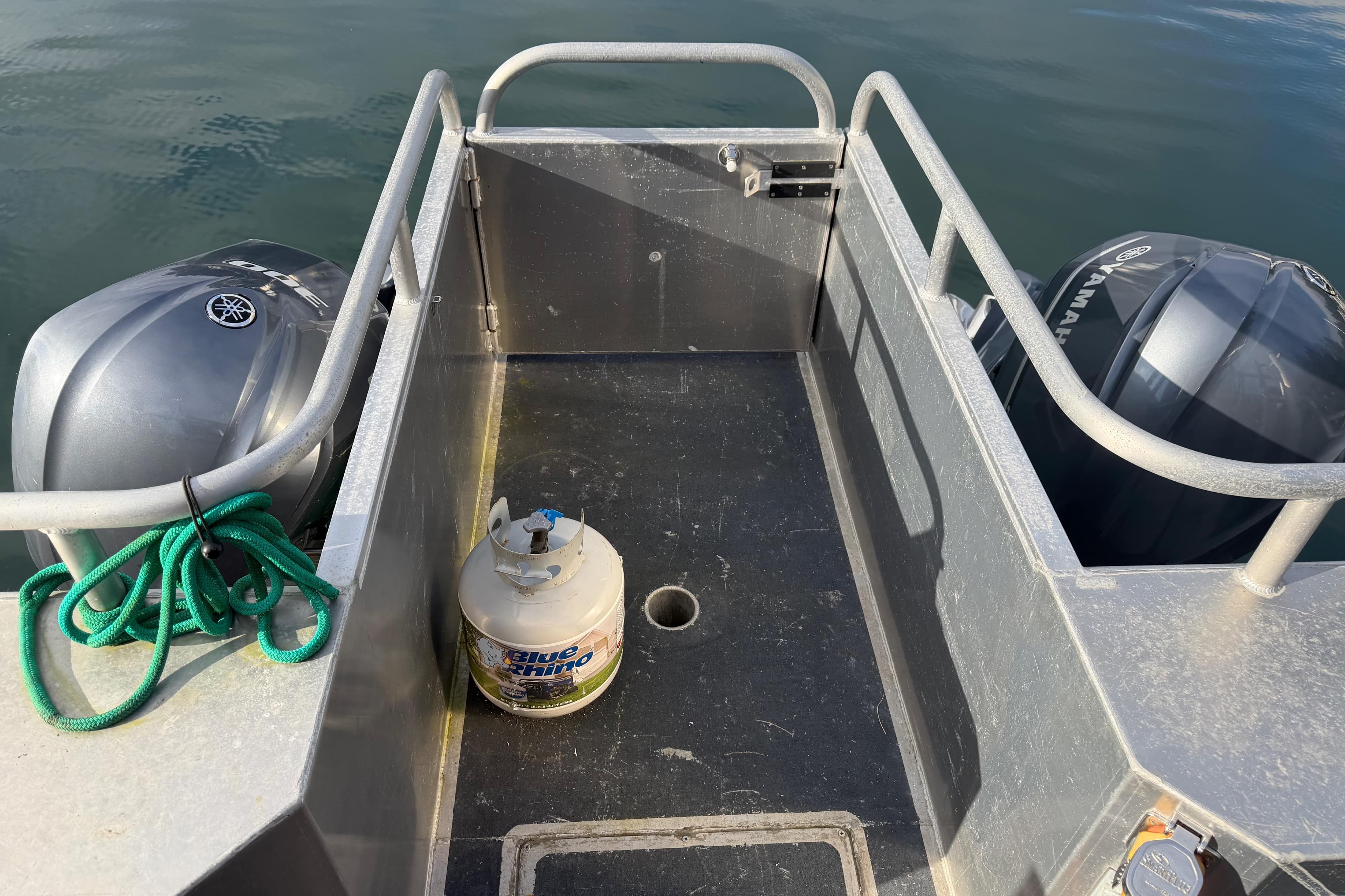 2020 Armstrong Marine 35 boat deck with twin Yamaha outboards and propane tank.
