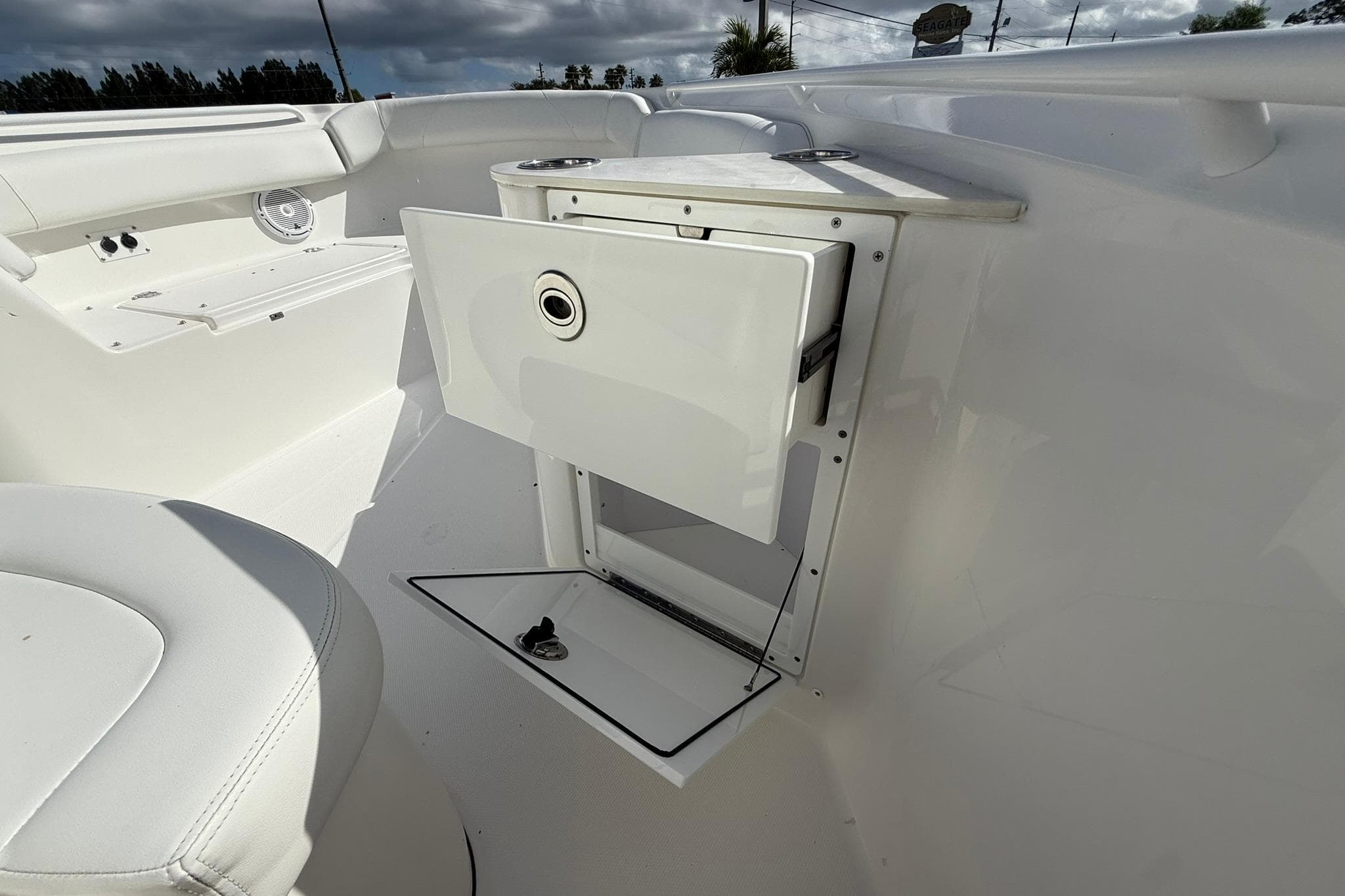 2021 Edgewater 262CC boat interior with storage compartment and seating.