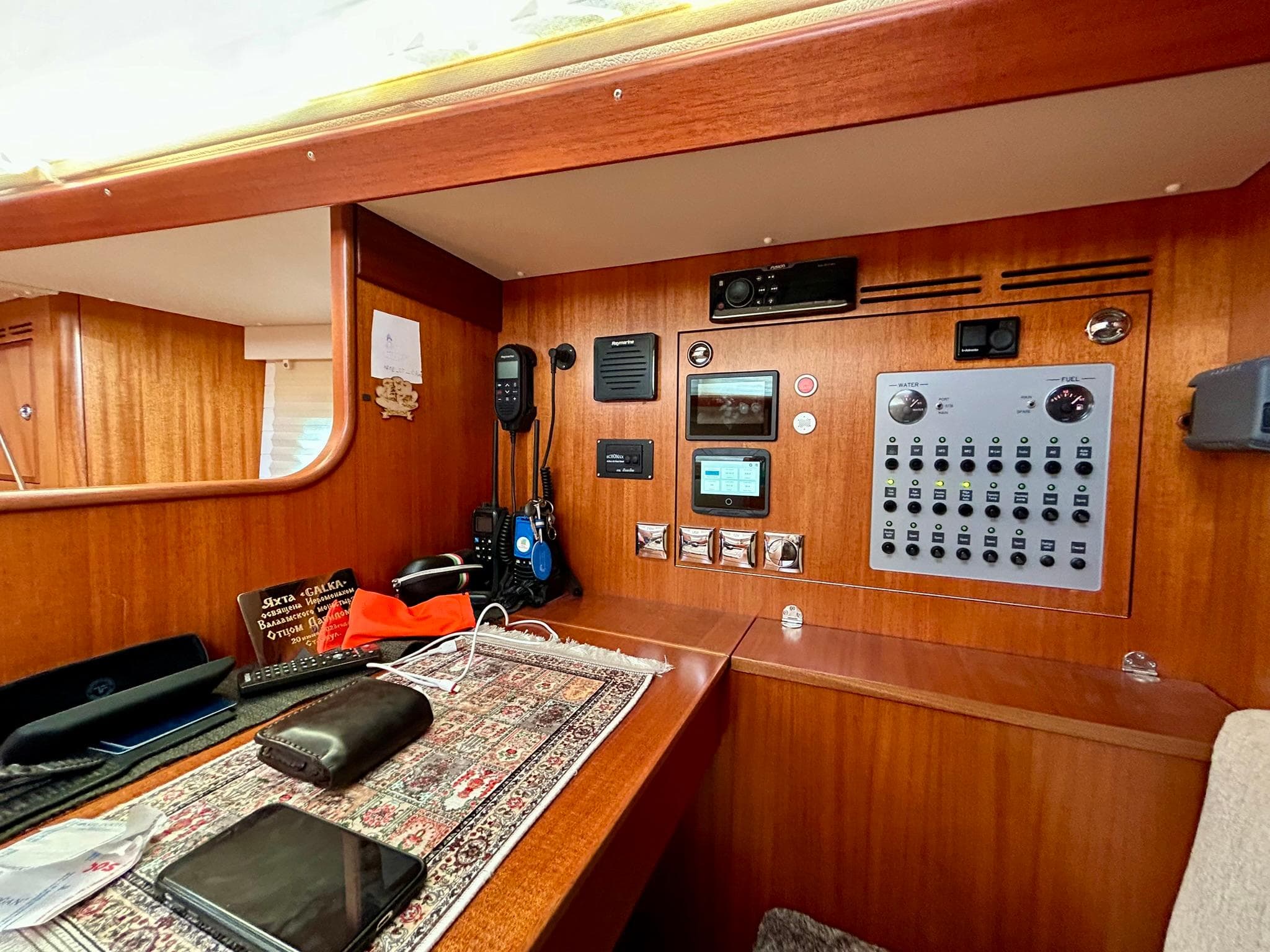 Interior of 2020 Hallberg-Rassy 44 yacht with navigation and control panel.