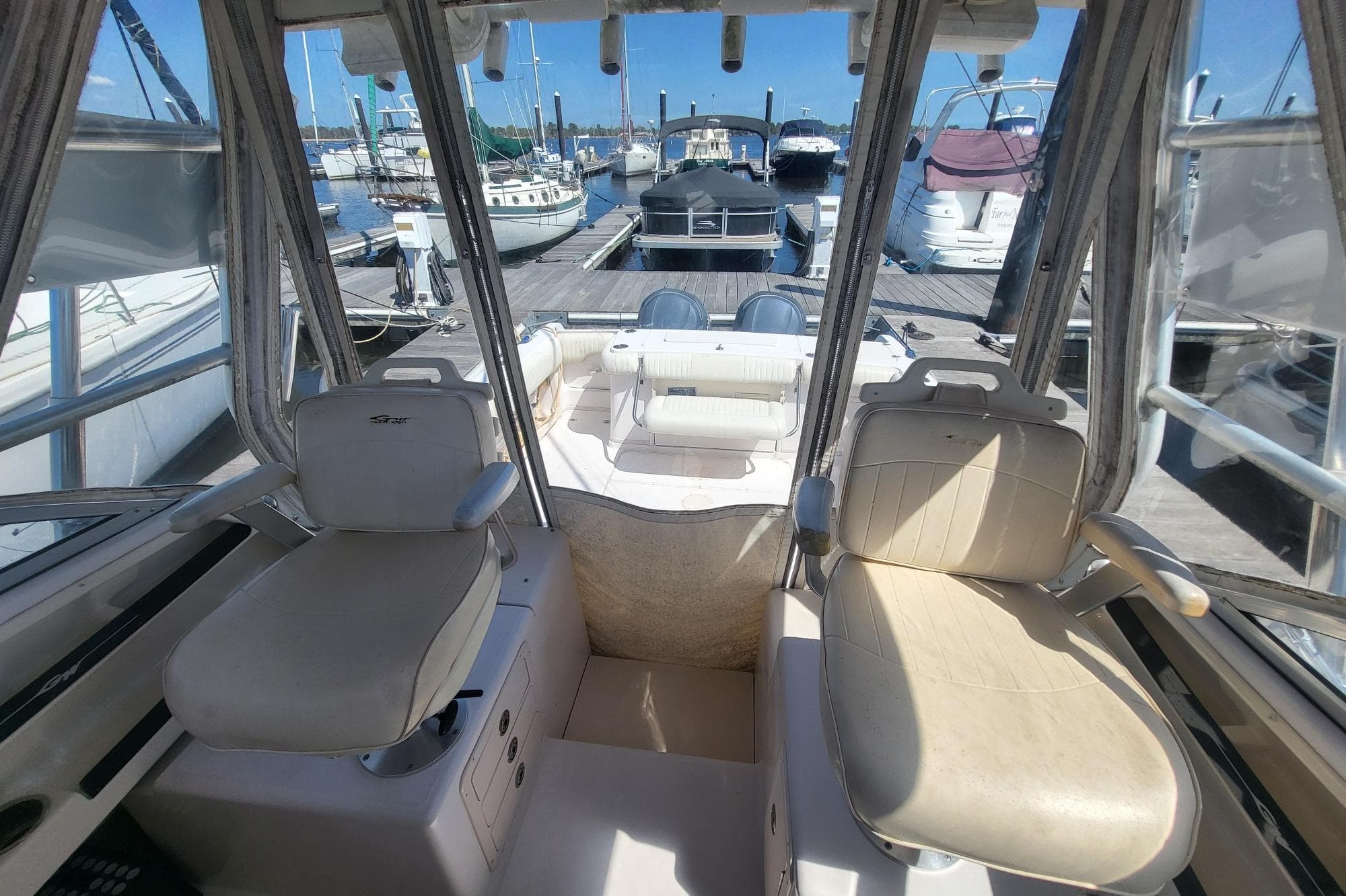 2004 Grady-White Marlin 300 boat interior with dual seats at marina.