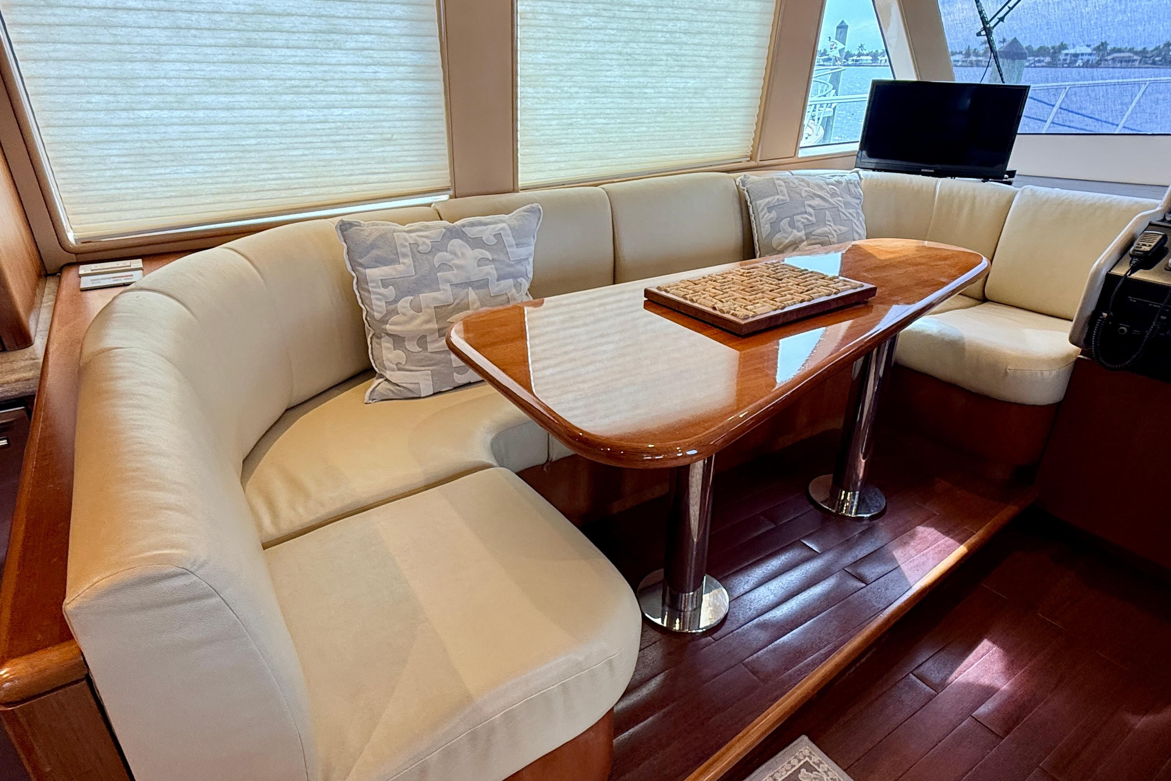 Luxurious interior of 2002 Cheoy Lee 72 Raised Pilot House Motor Yacht with elegant seating.