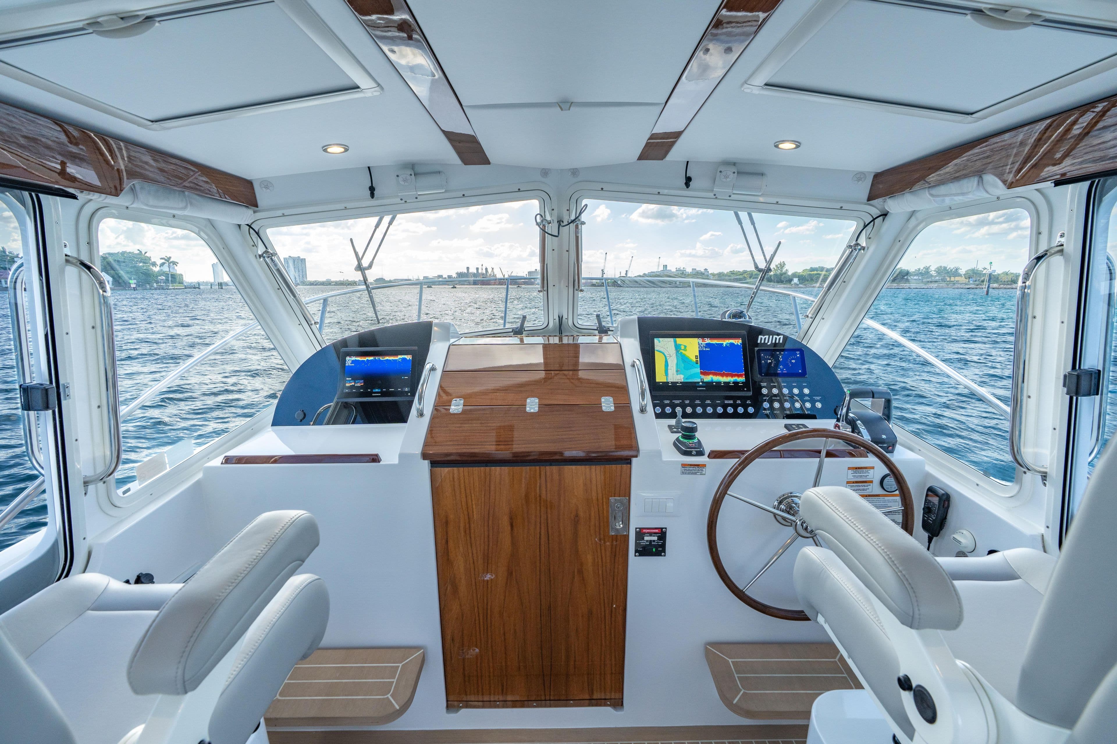 2026 MJM 38 RS yacht interior with modern navigation equipment and luxurious seating.