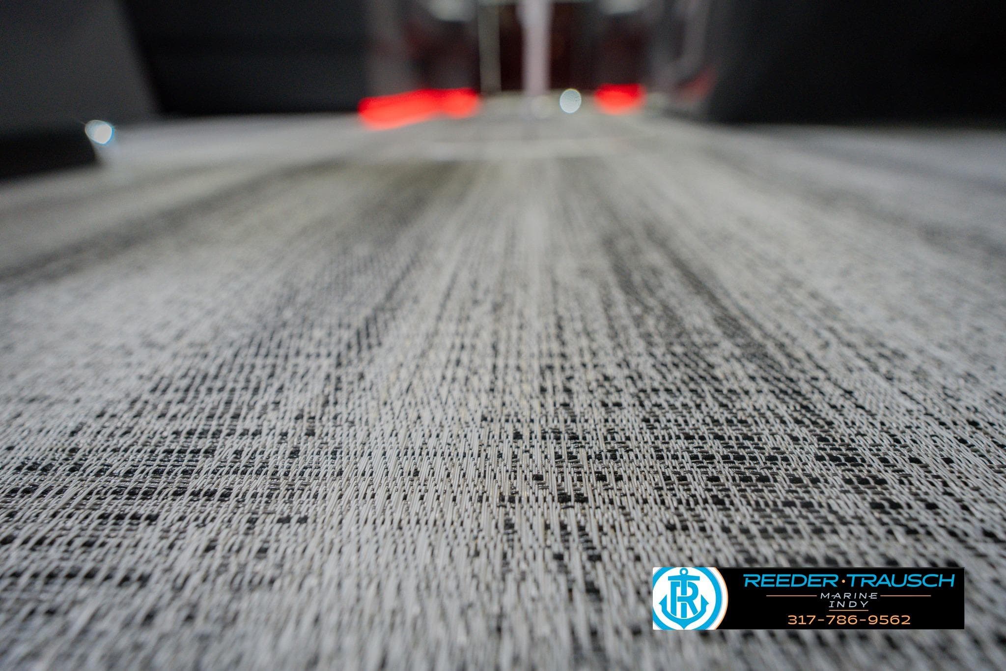 2026 Bennington 22 SSB boat flooring with textured design, Reeder-Trausch Marine logo.