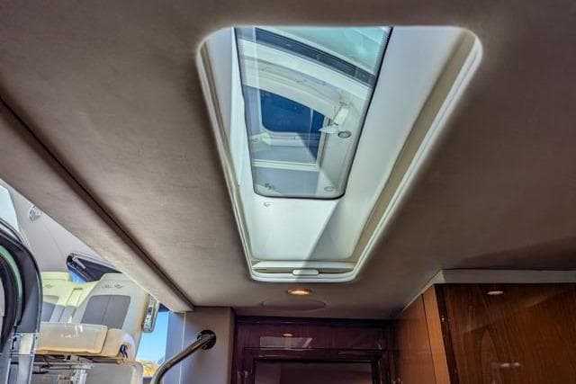 Interior view of 2013 Sea Ray 470 Sundancer yacht with skylight.