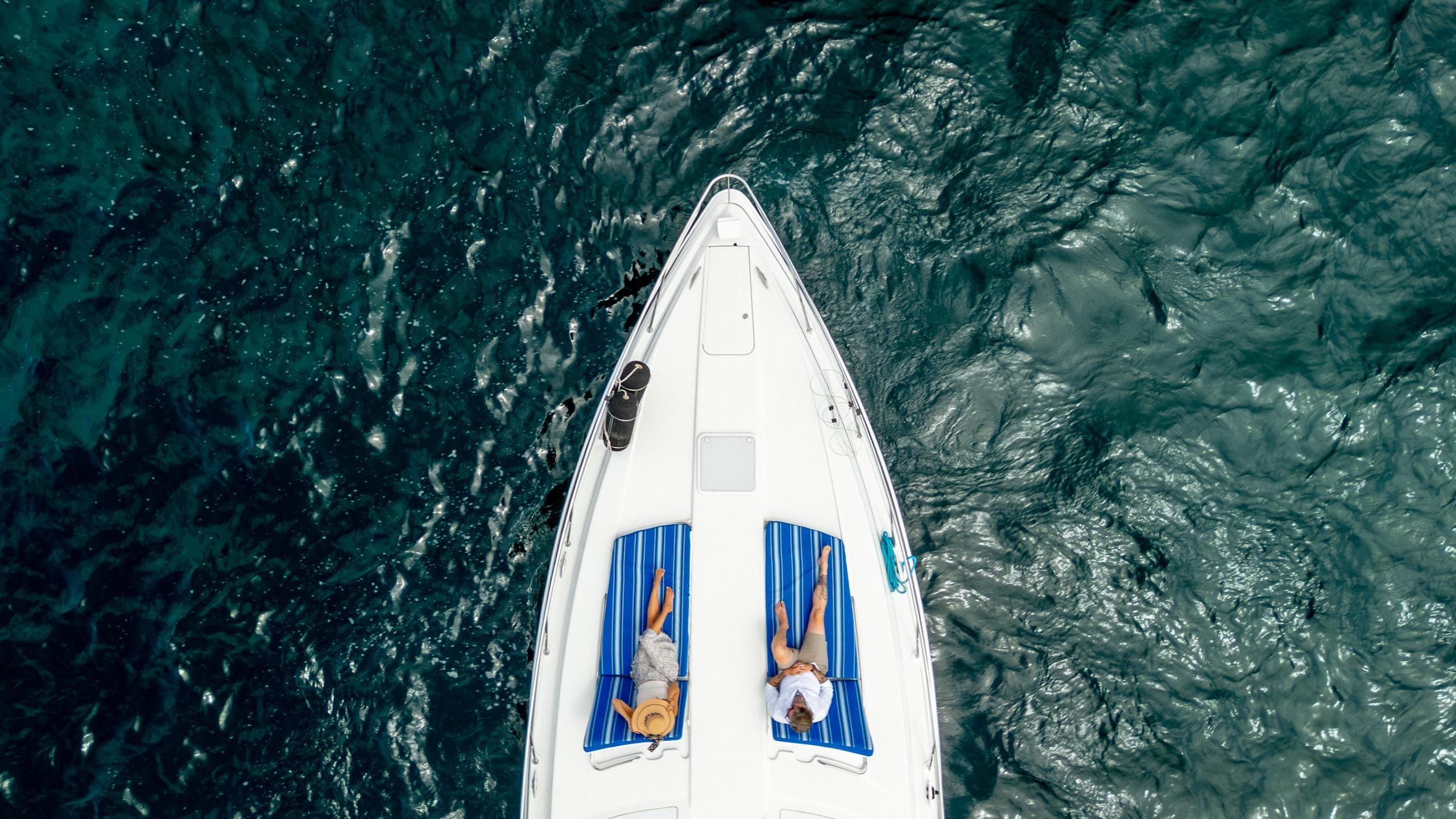 Aerial view of a 2007 Formula 45 Yacht with two people sunbathing on deck.