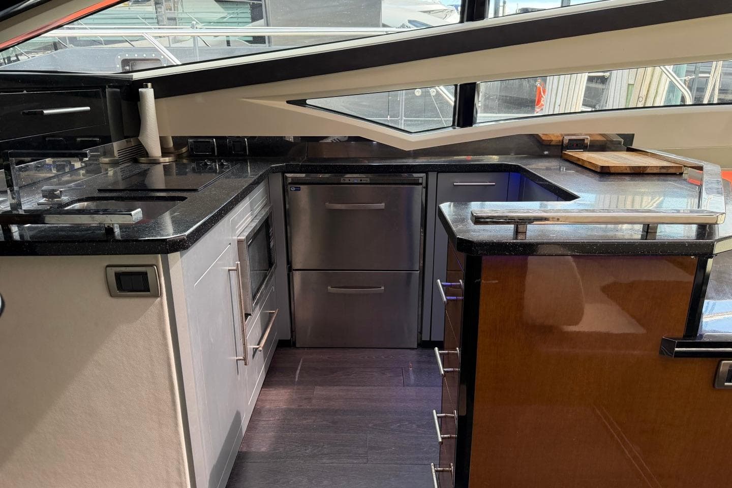 Luxurious kitchen interior of 2009 Marquis 500 Sport Coupe yacht with modern appliances.