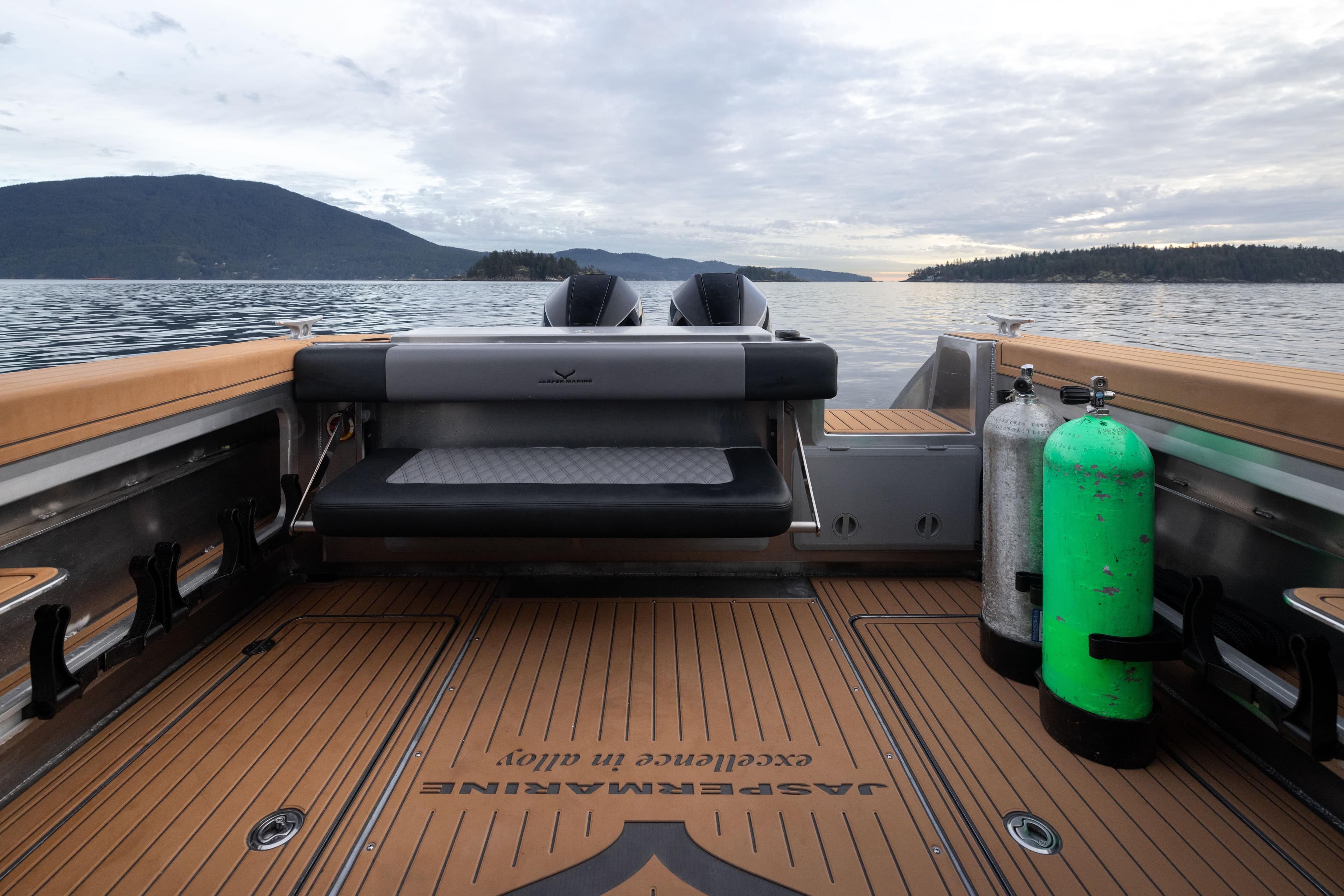 2026 Jasper Marine Defender 22 boat interior with diving gear, scenic lake view.