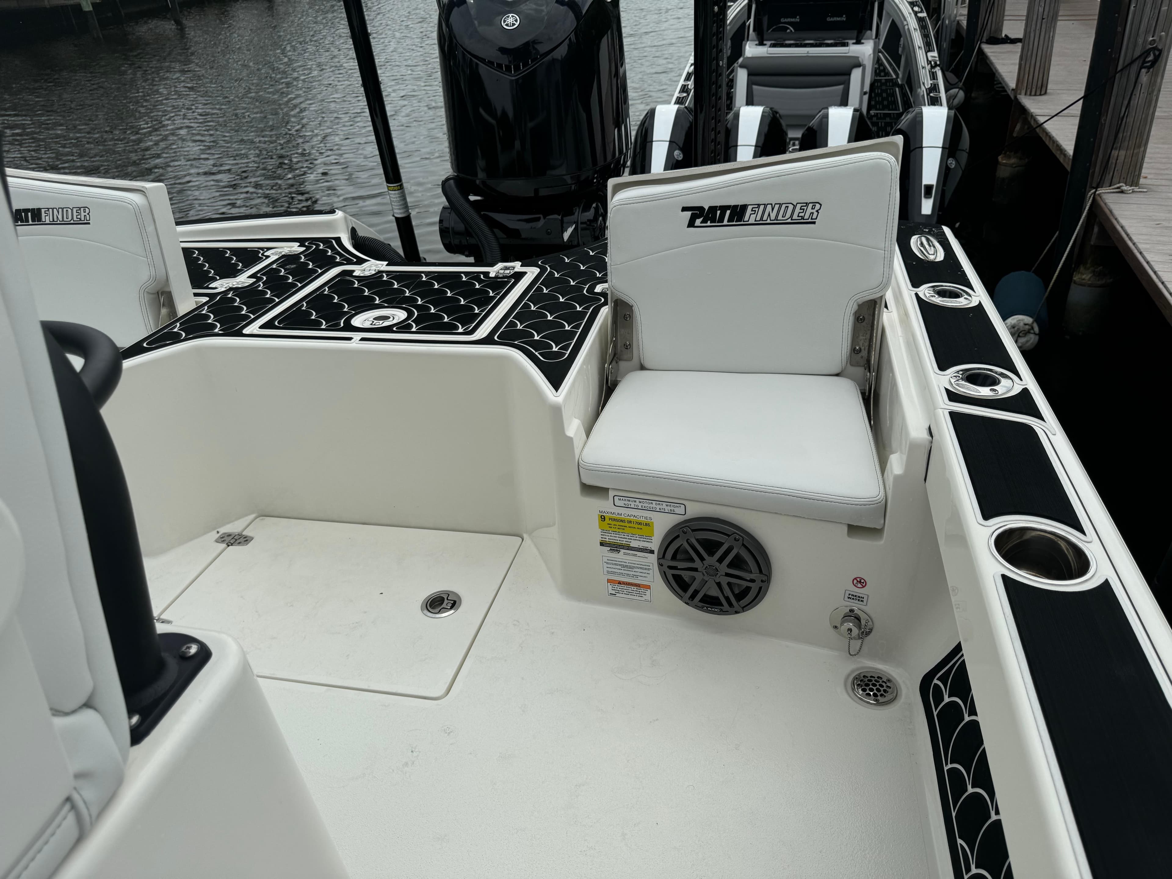 2024 Pathfinder 2500 Hybrid boat interior with seating and storage compartments.