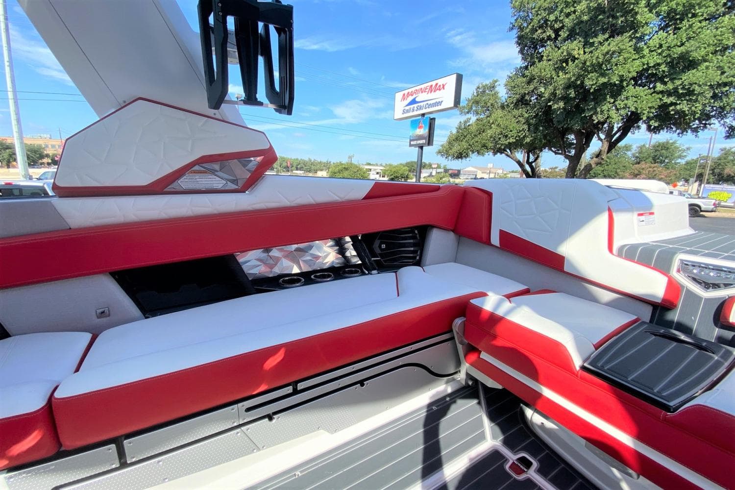 Interior of 2023 Nautique Super Air Nautique G25 Paragon boat with red and white seating.