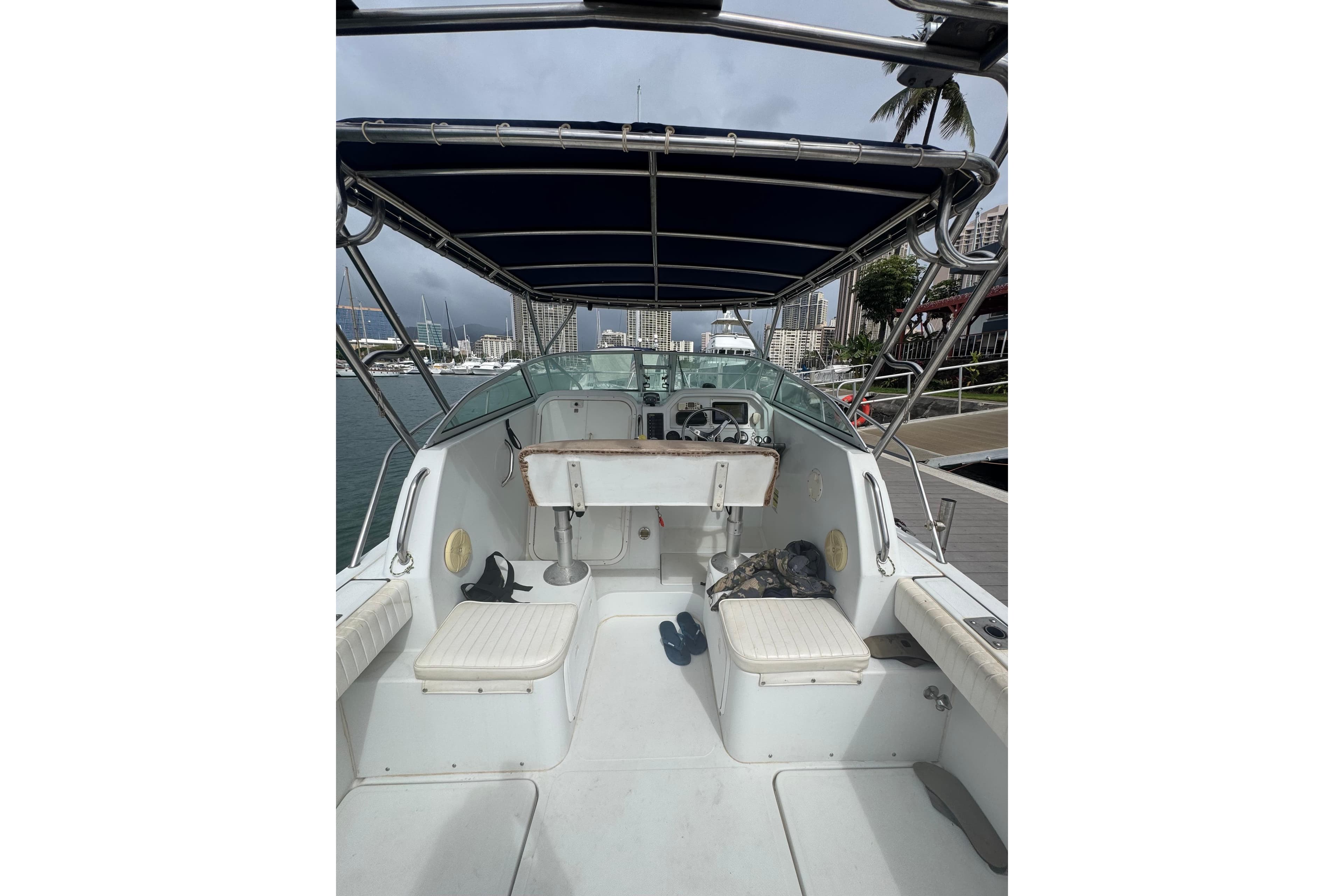 2004 Glacier Bay 2270 Isle Runner boat interior with seating and steering console.