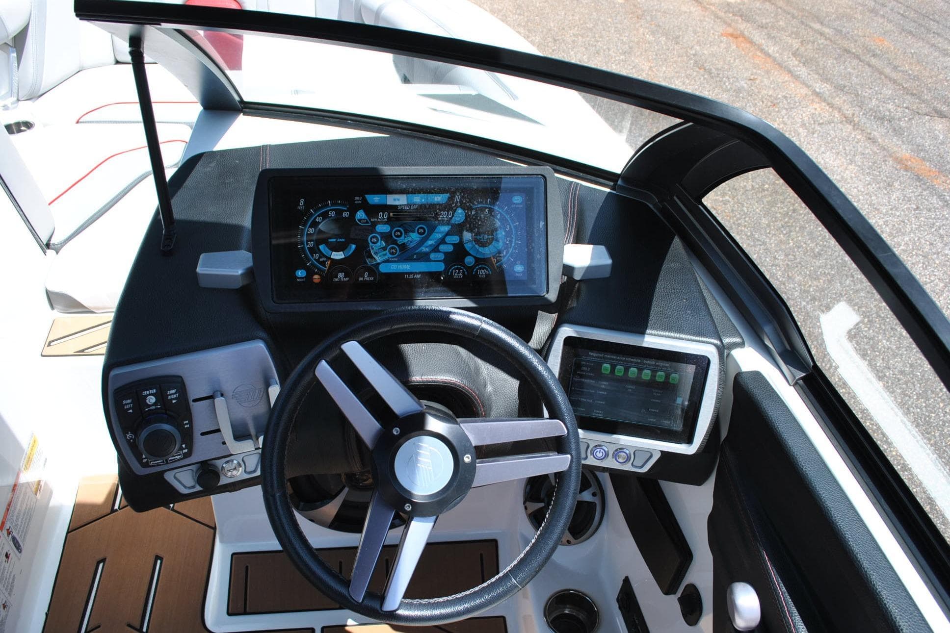 2018 Malibu Wakesetter 21 MLX dashboard with steering wheel and digital displays.