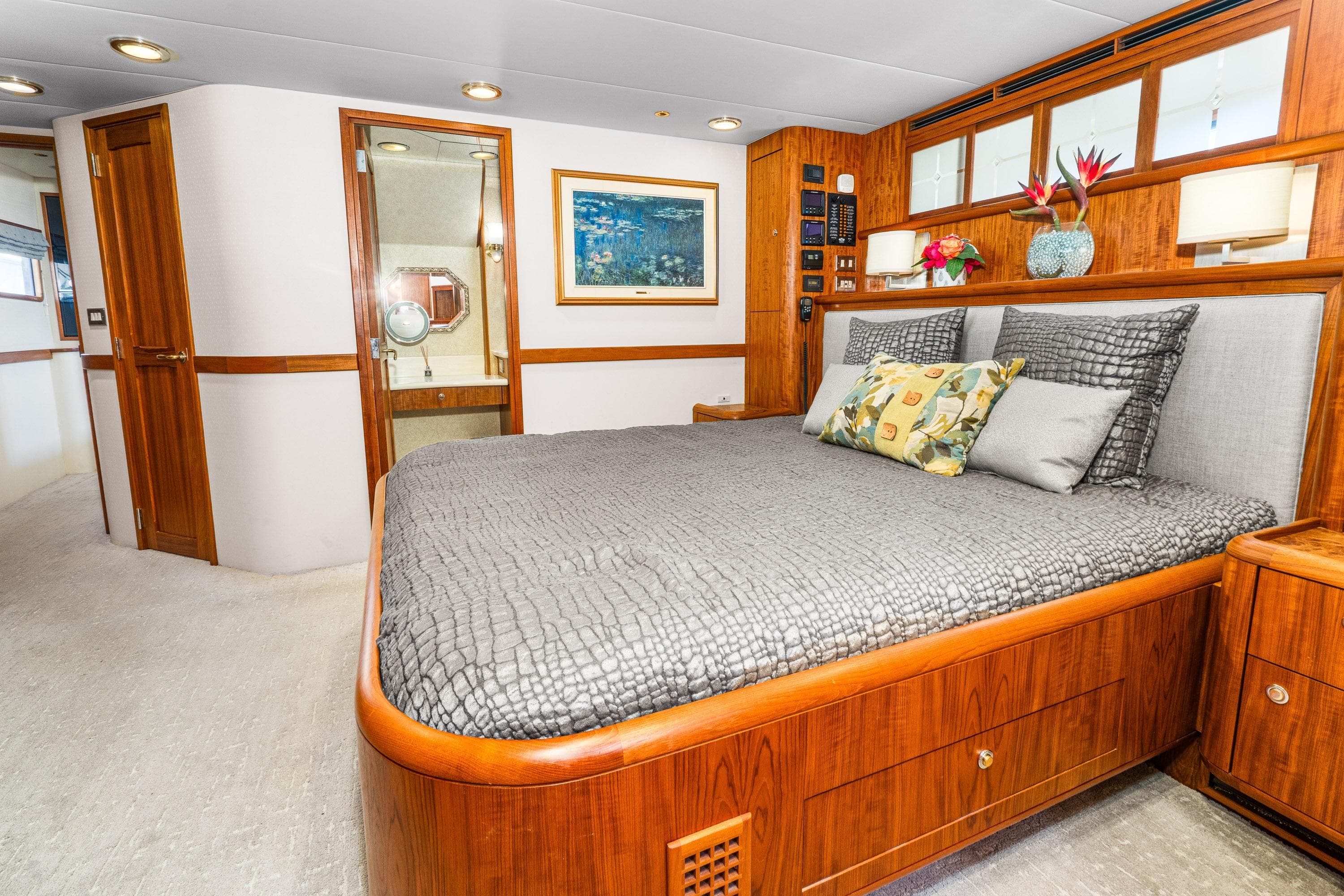 Luxurious 1998 Northern Marine Trawler bedroom with elegant wood finishes and modern decor.
