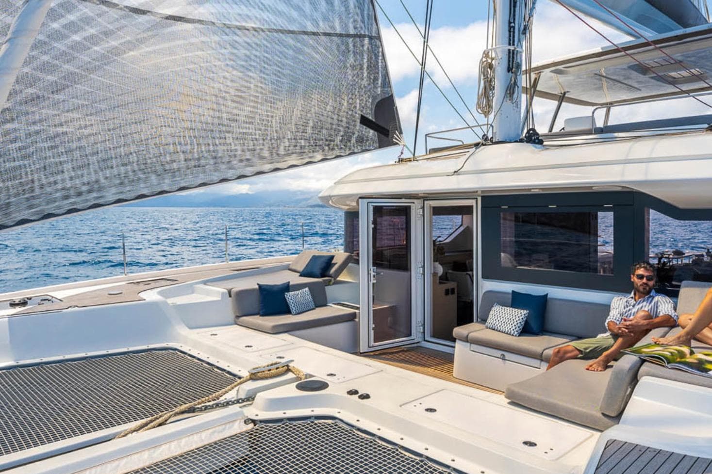 Luxurious 2026 Lagoon 60 yacht with spacious deck and comfortable seating.