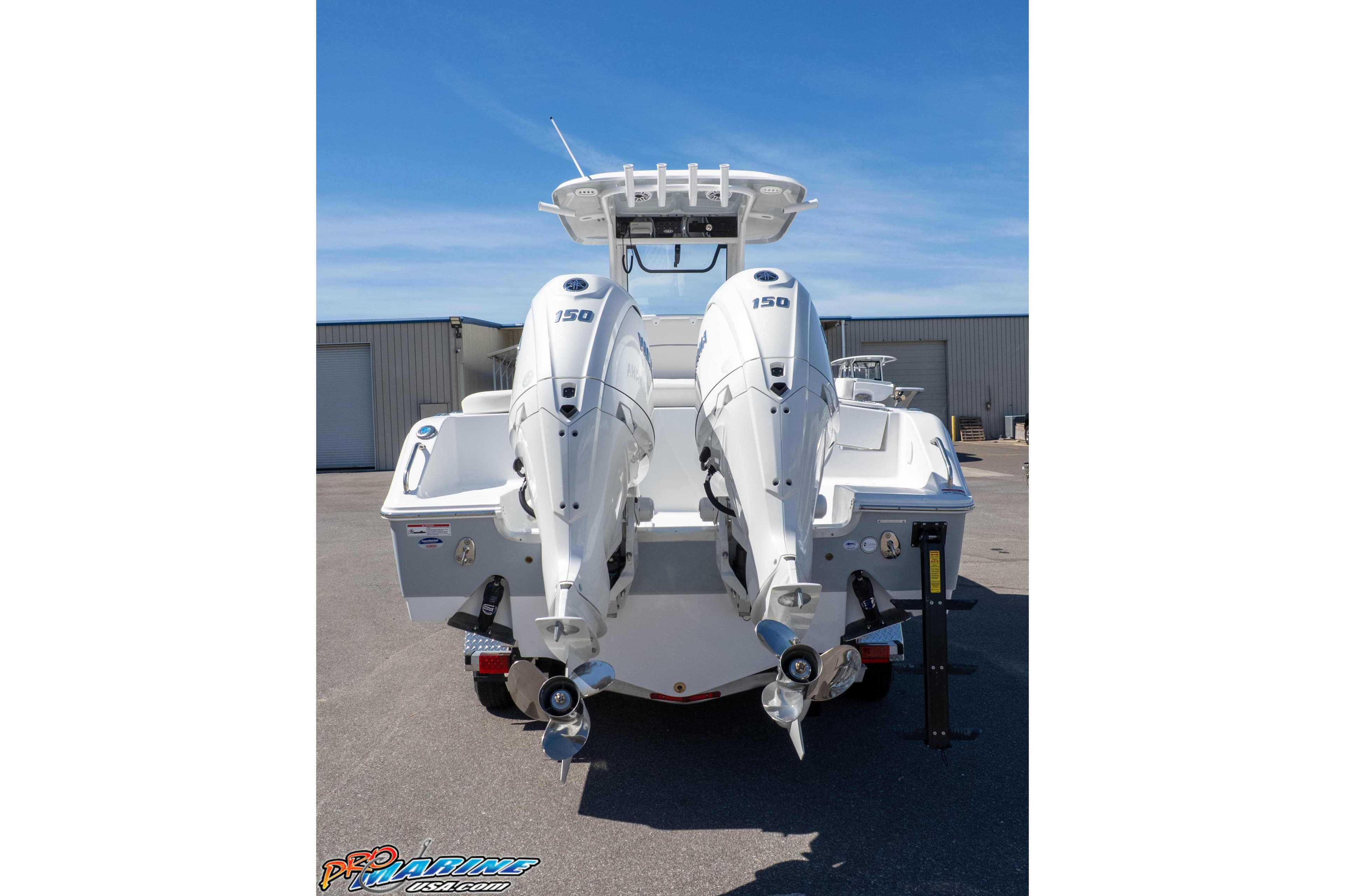 2026 Sea Hunt Ultra 265 SE boat with dual outboard motors, rear view.
