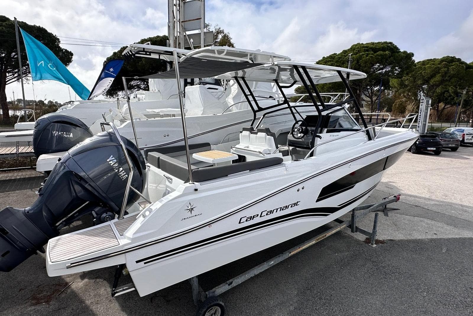 2025 Jeanneau Cap Camarat 7.5 WA Serie 3 boat with Yamaha engines, docked outdoors.