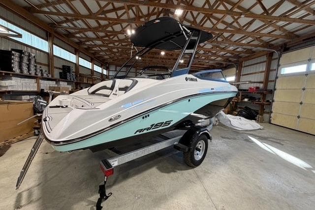 2026 Yamaha Boats AR195 in a garage, showcasing sleek design and modern features.