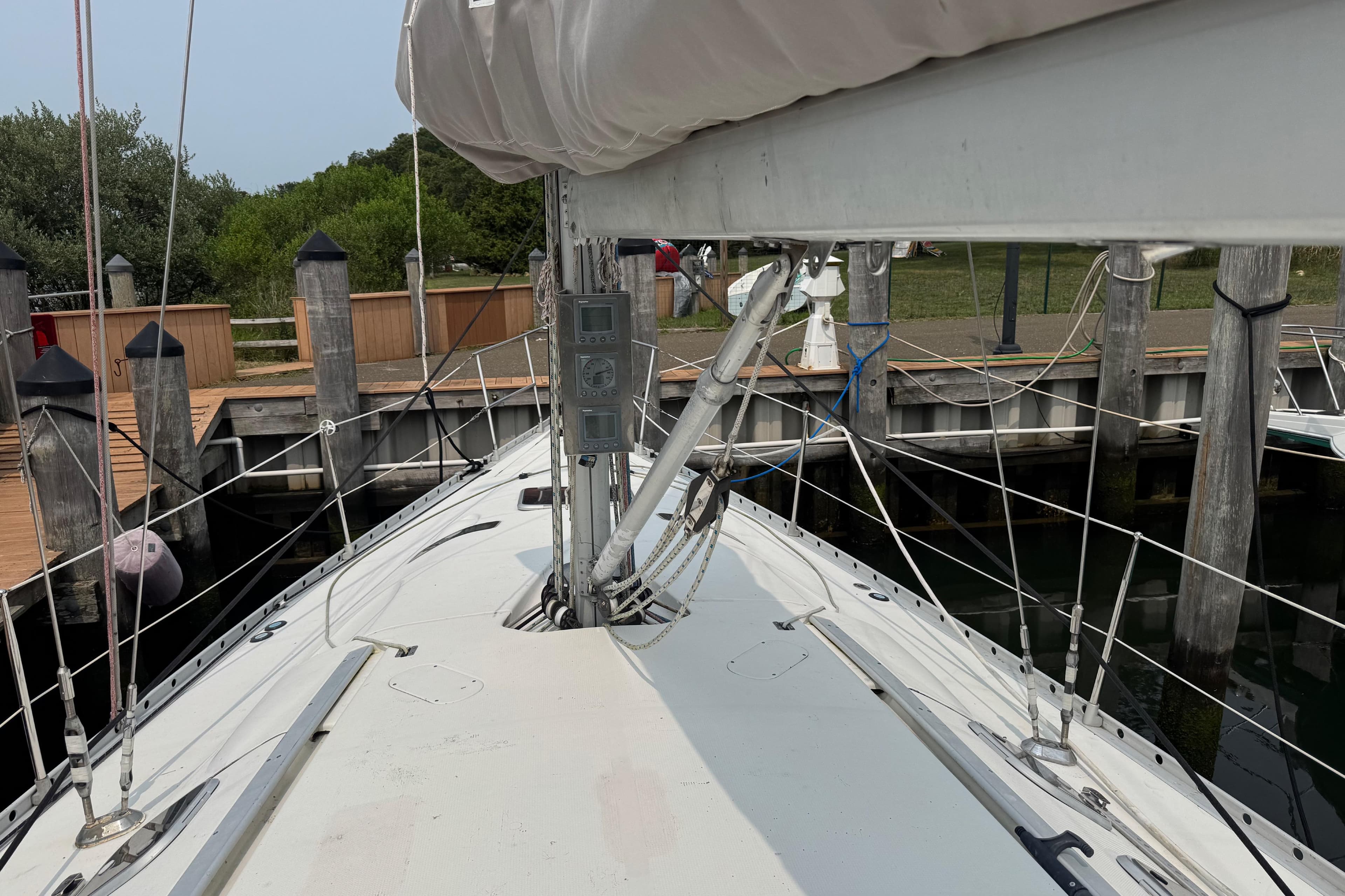 1989 Beneteau First 41s5 sailboat docked, showing deck and rigging details.