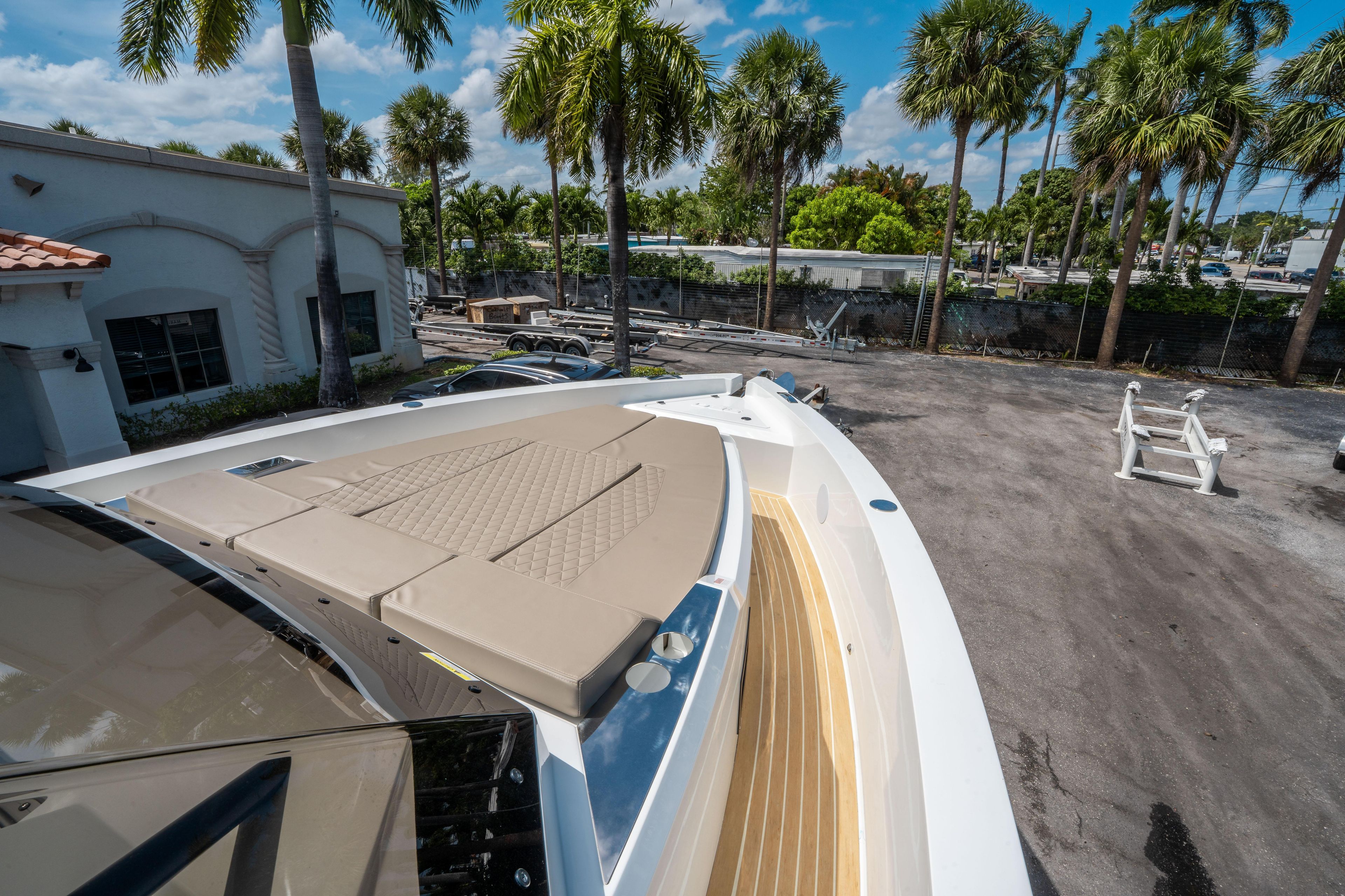 2025 De Antonio Yachts D36 OPEN with sun deck, surrounded by palm trees.