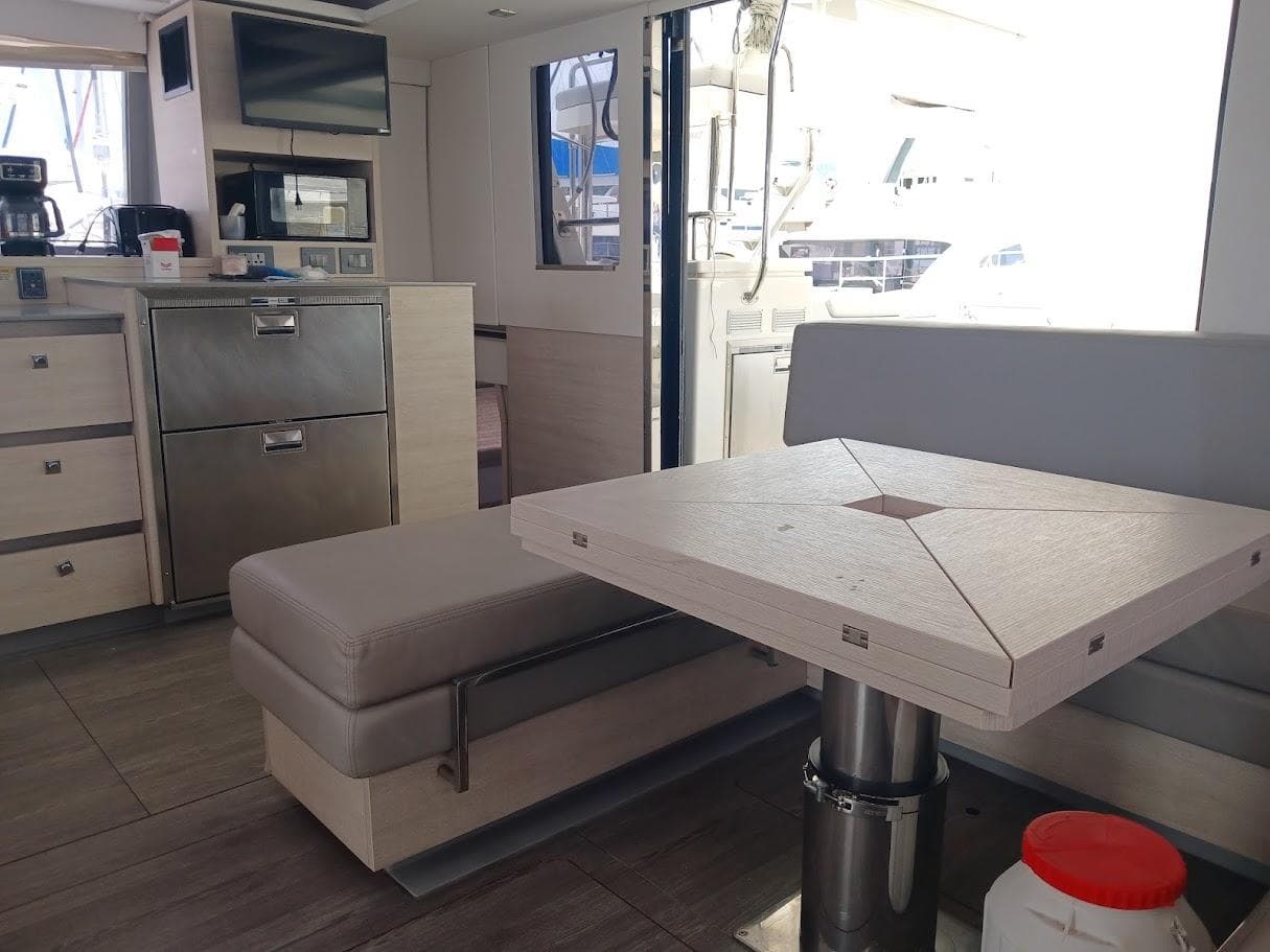Interior of 2020 Leopard 50 yacht with modern kitchen and dining area.