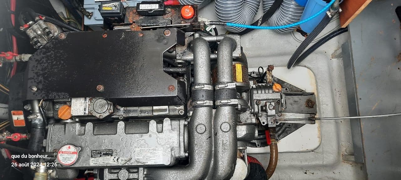Engine compartment of a 2019 Lagoon LAGOON 50 catamaran, showcasing mechanical components and wiring.