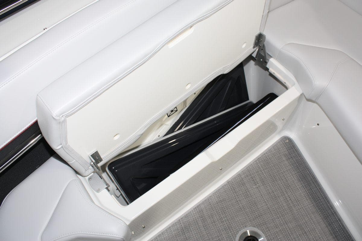2023 Formula 380 Super Sport Crossover OB boat storage compartment with open seat and visible interior.