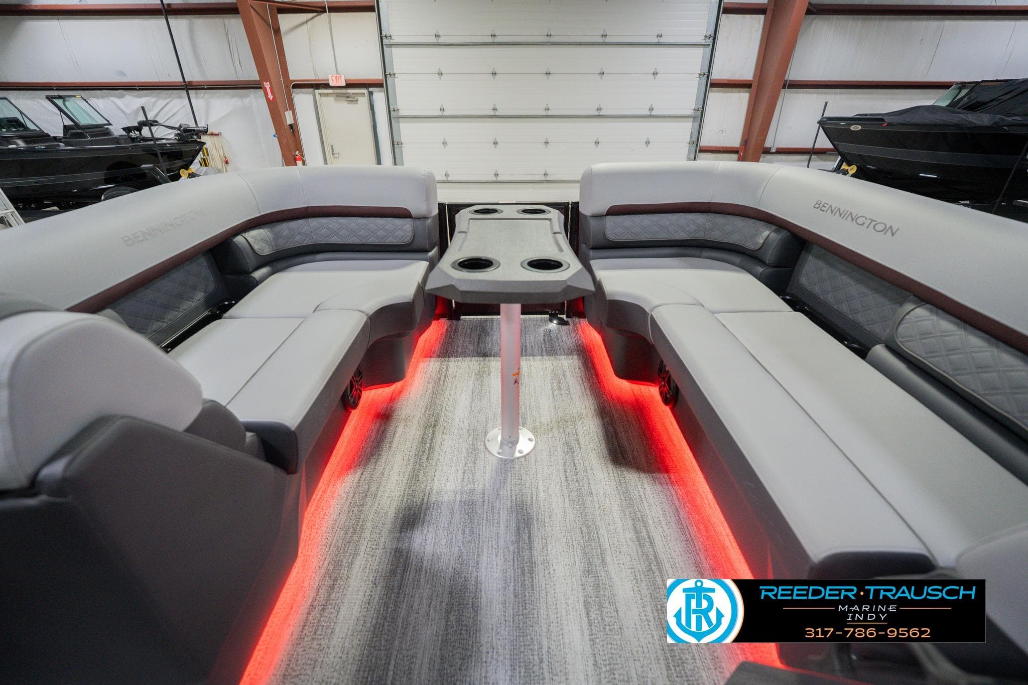 2026 Bennington 22 SSB boat interior with gray seating and red LED lighting.