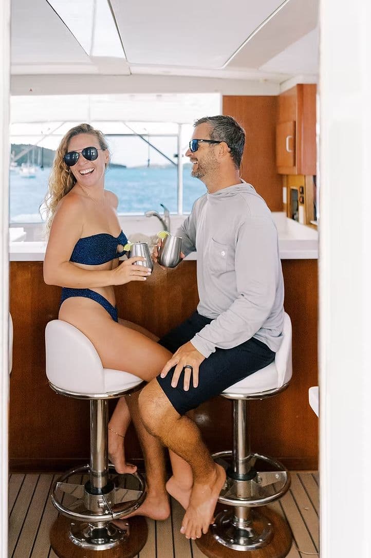 Couple enjoying drinks on Leopard 44 yacht, 2011.