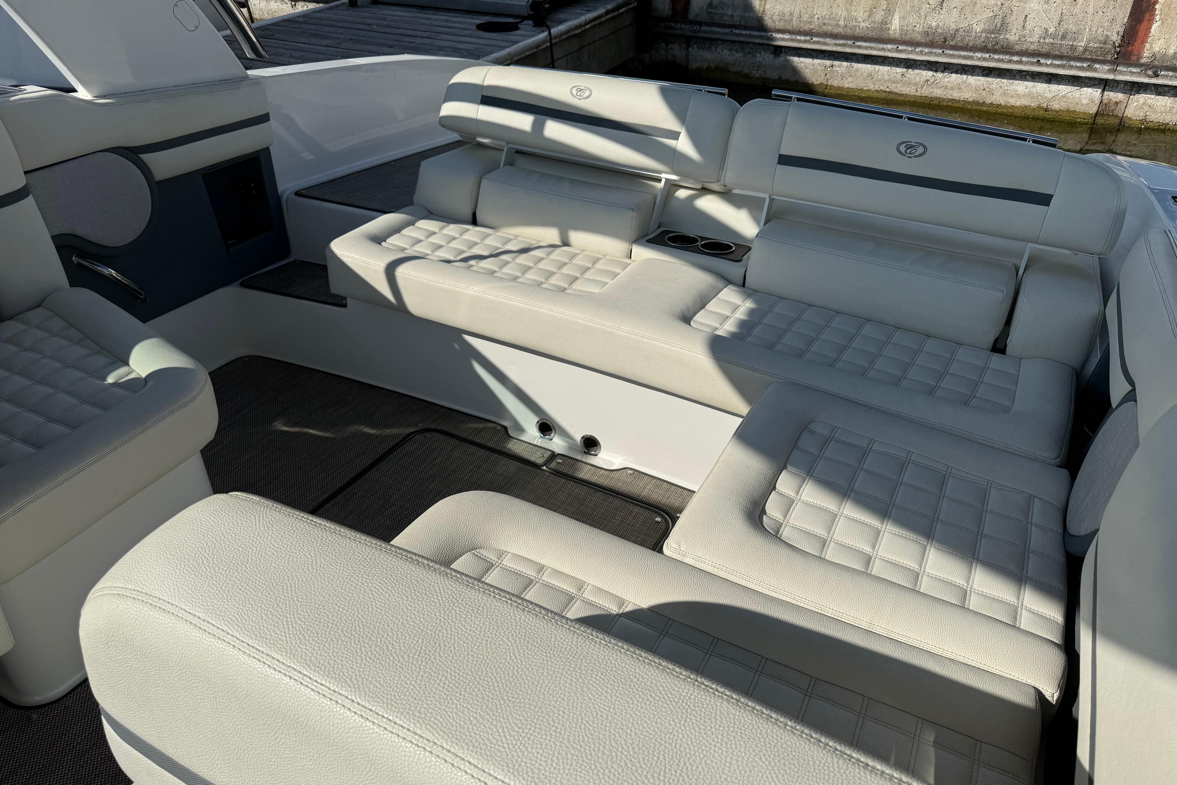 Luxurious seating area on a 2017 Cobalt R30 boat with quilted upholstery.