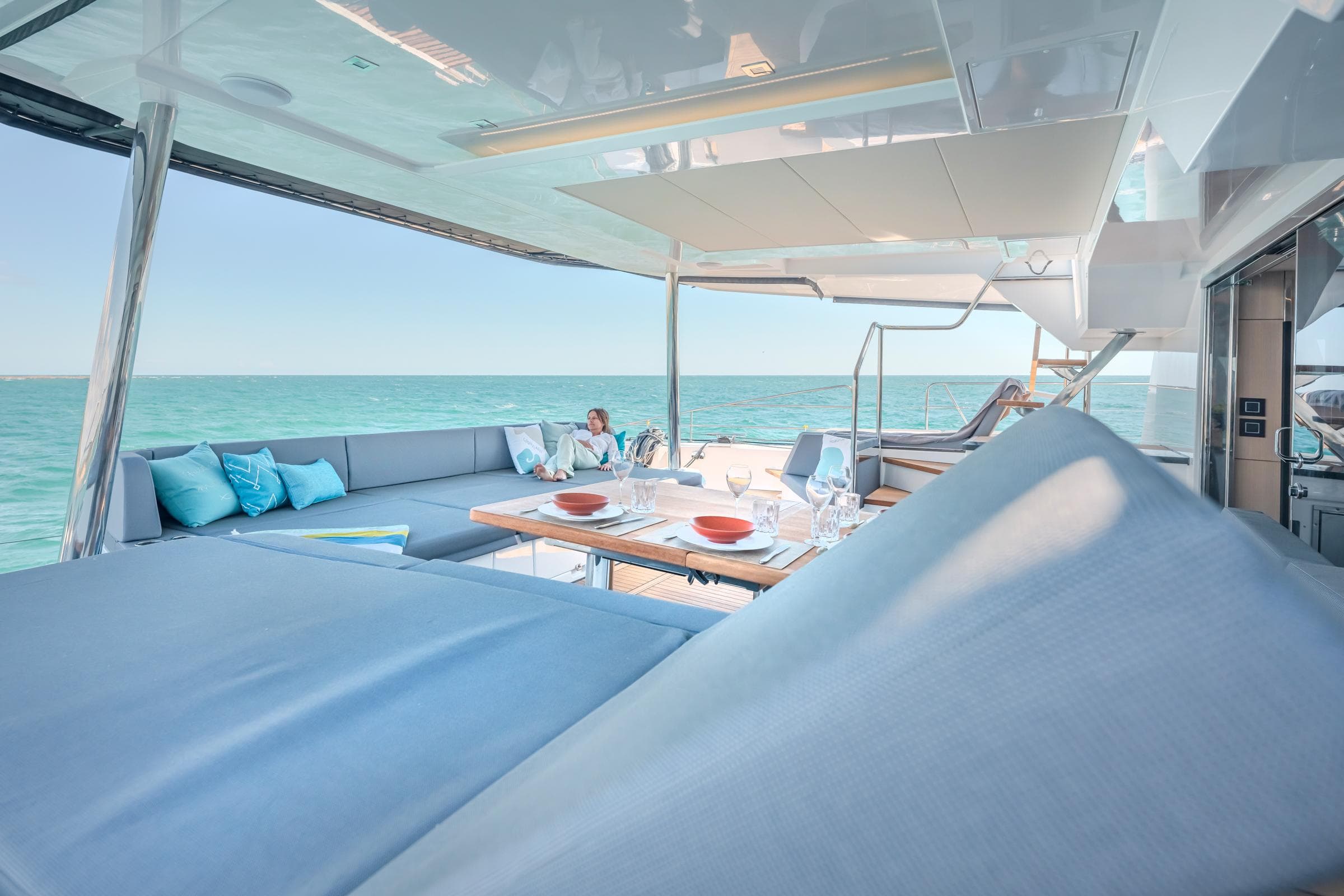 Luxurious 2025 Privilege Signature 650 yacht with elegant outdoor seating and ocean view.