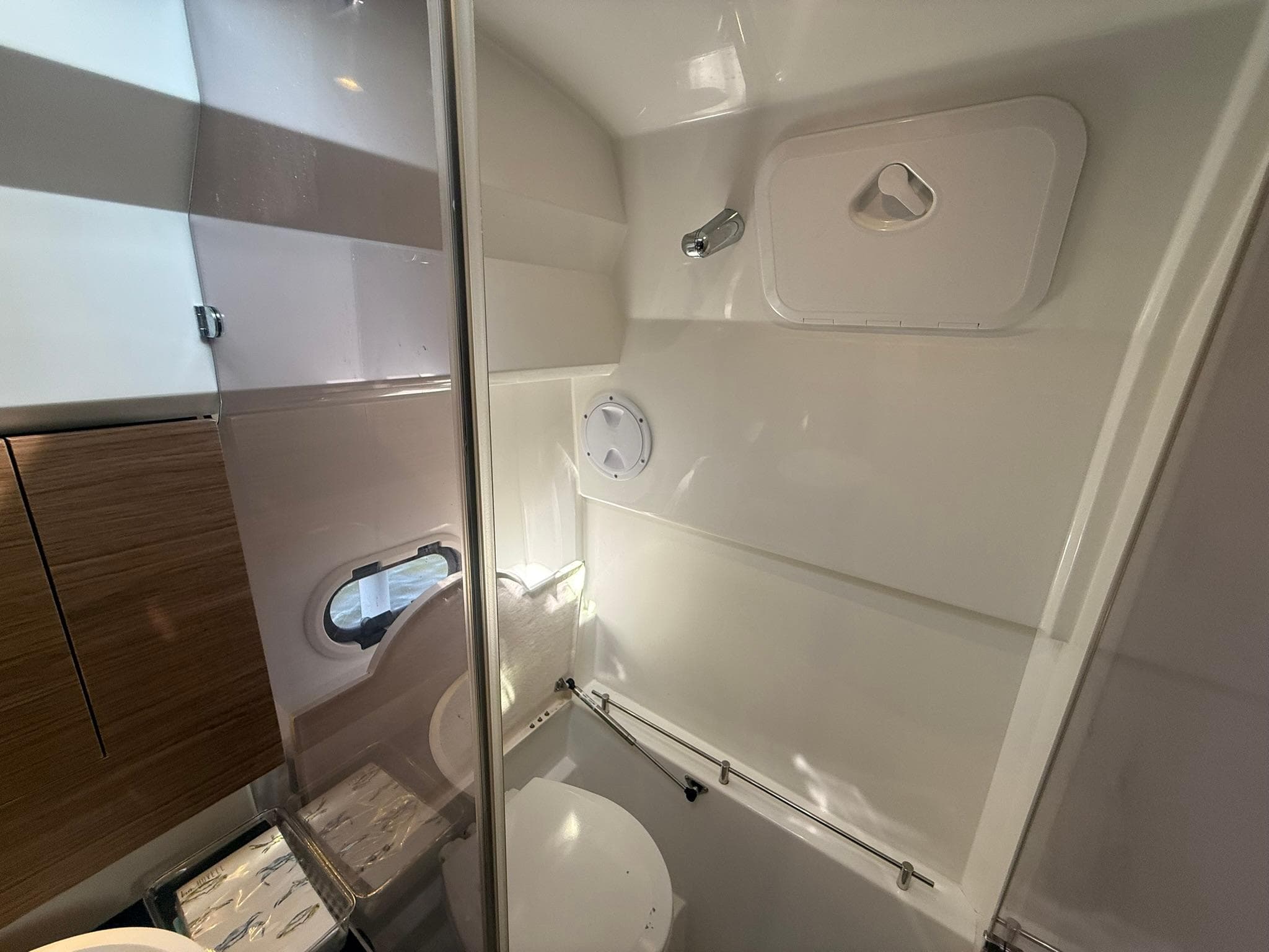 Interior of 2018 Jeanneau Leader 10.5 boat bathroom with modern fixtures.