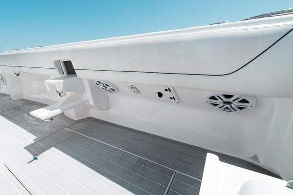 2022 Intrepid 407 Nomad FE boat interior with sleek white design and built-in speakers.