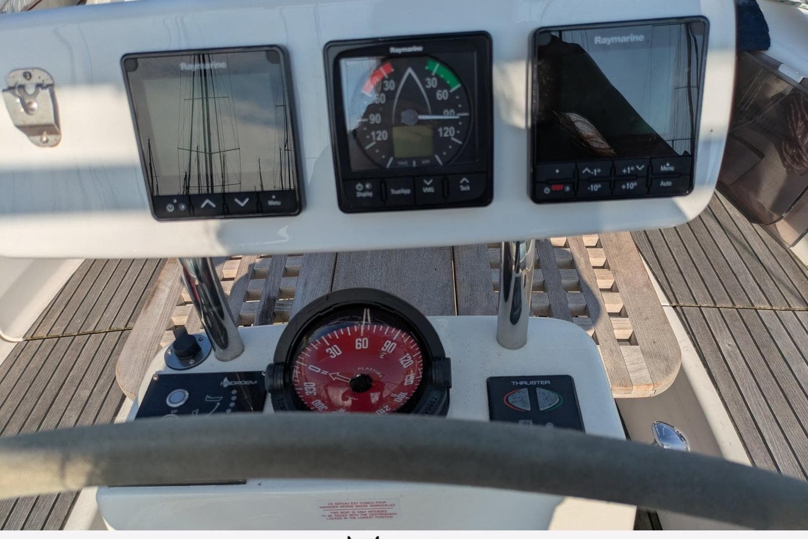 Cockpit instruments of a 2004 Feeling 44 DI yacht, featuring navigation displays and compass.