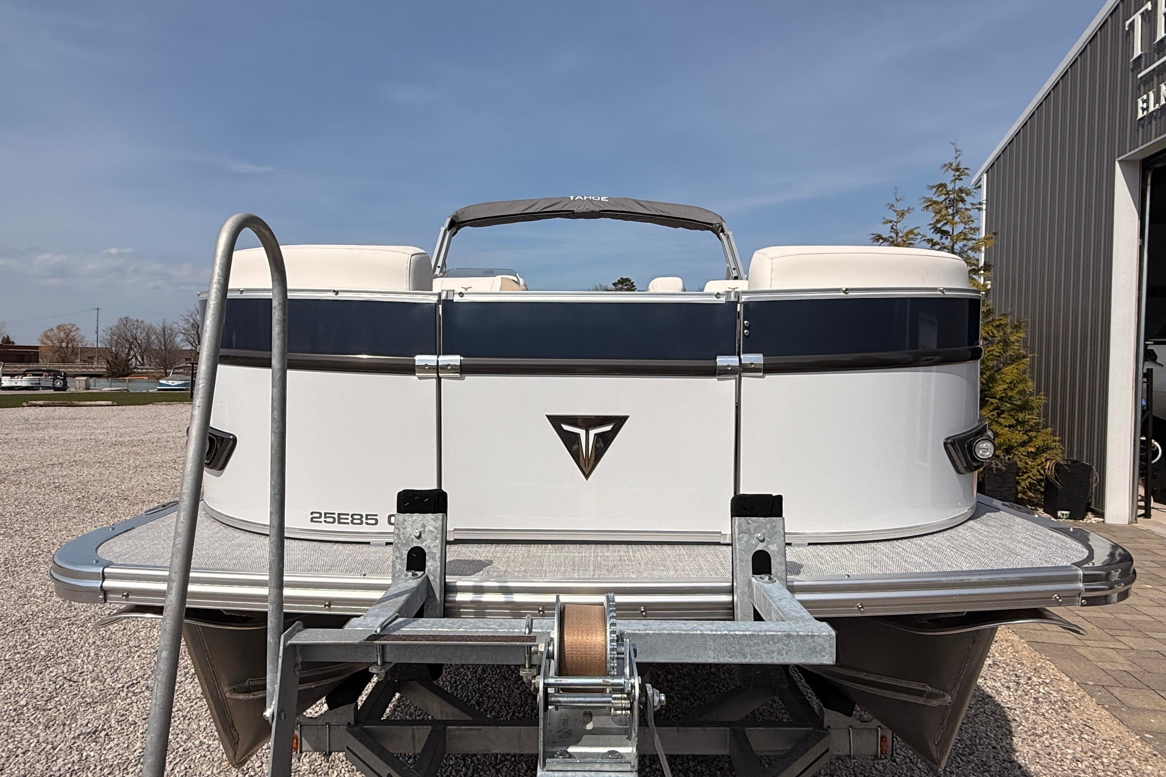 2026 Tahoe Pontoon Cascade Quad Lounger 25' on trailer, parked outdoors.