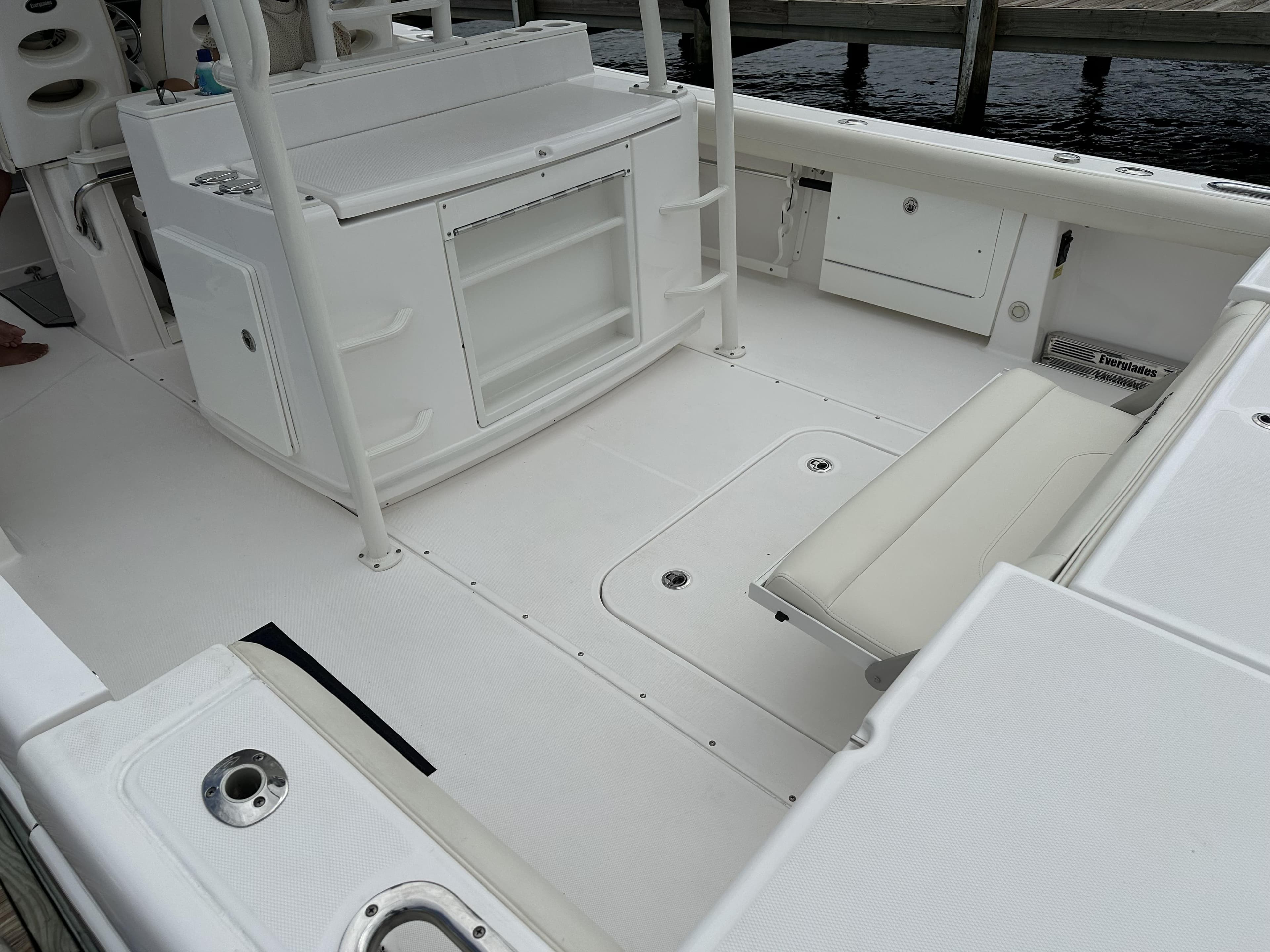 2017 Everglades 435 Center Console boat interior with seating and storage compartments.