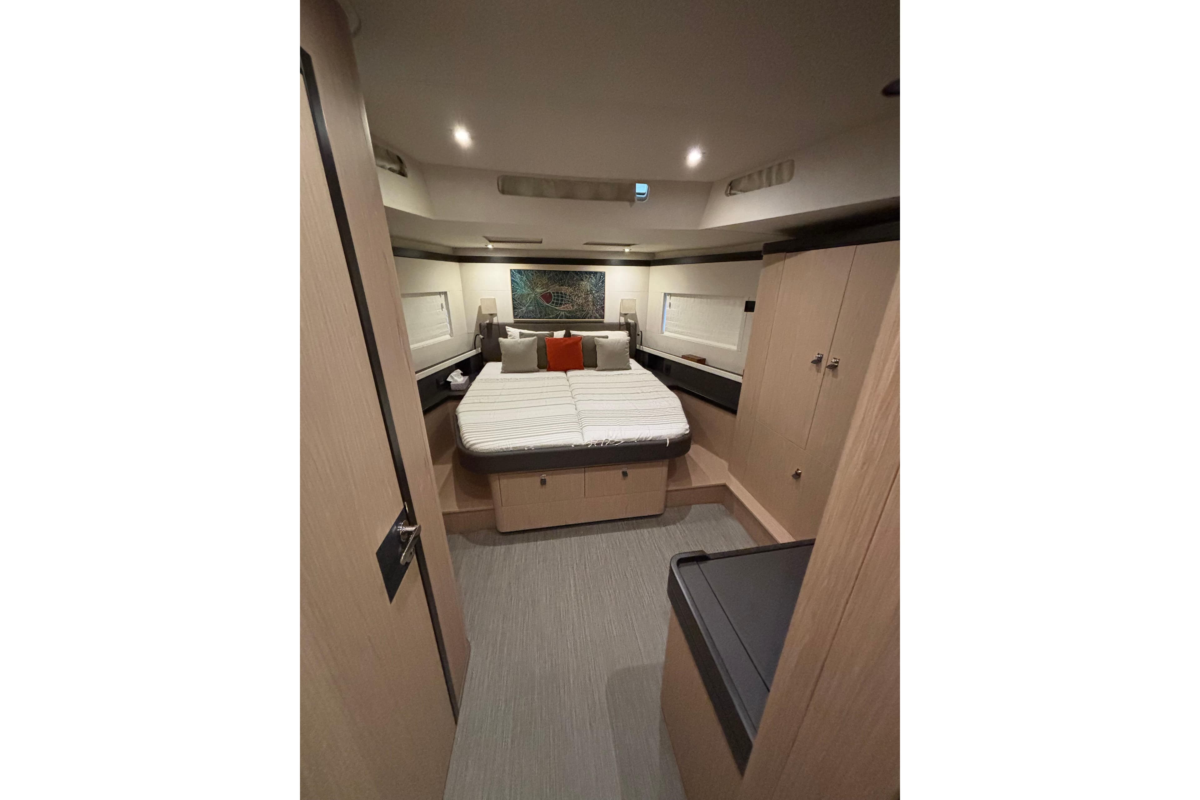 Luxurious cabin interior of 2018 Beneteau Oceanis Yacht 62 with modern furnishings.