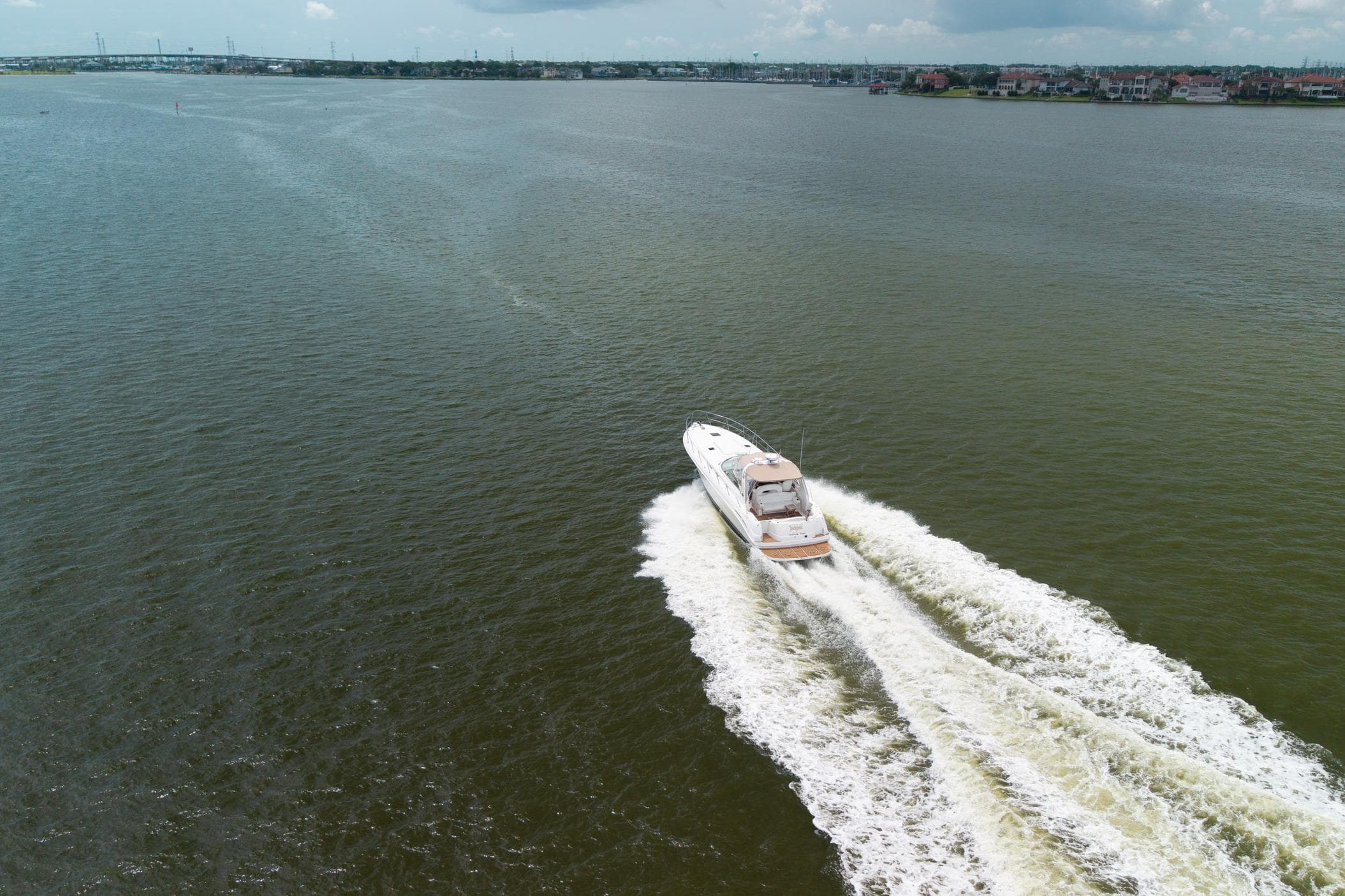 Aerial view of 2002 Sea Ray 410 Express Cruiser on open water.