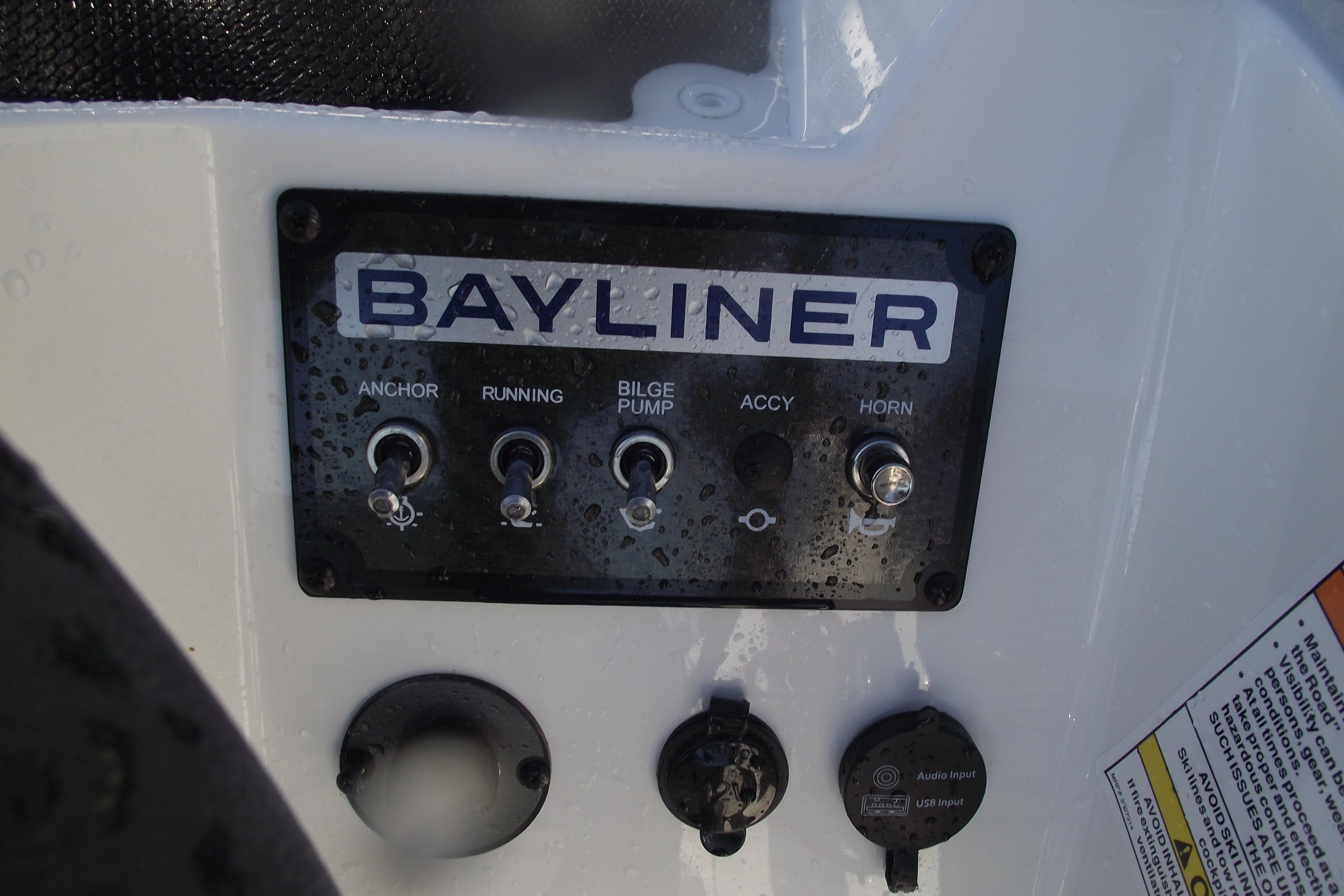 Control panel of 2026 Bayliner M19 boat with switches and inputs.