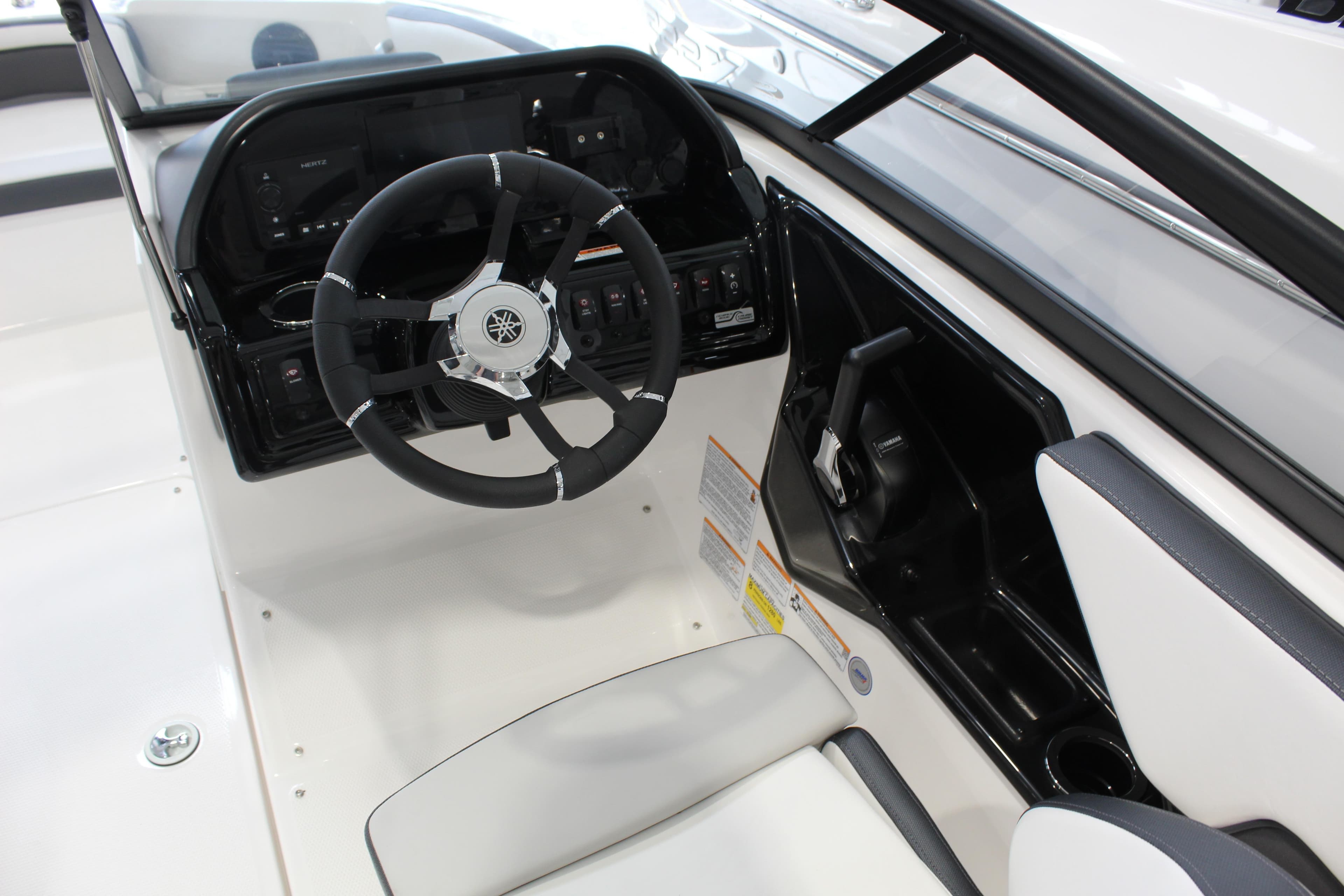 2026 Yamaha Boats 195S cockpit with steering wheel and control panel.