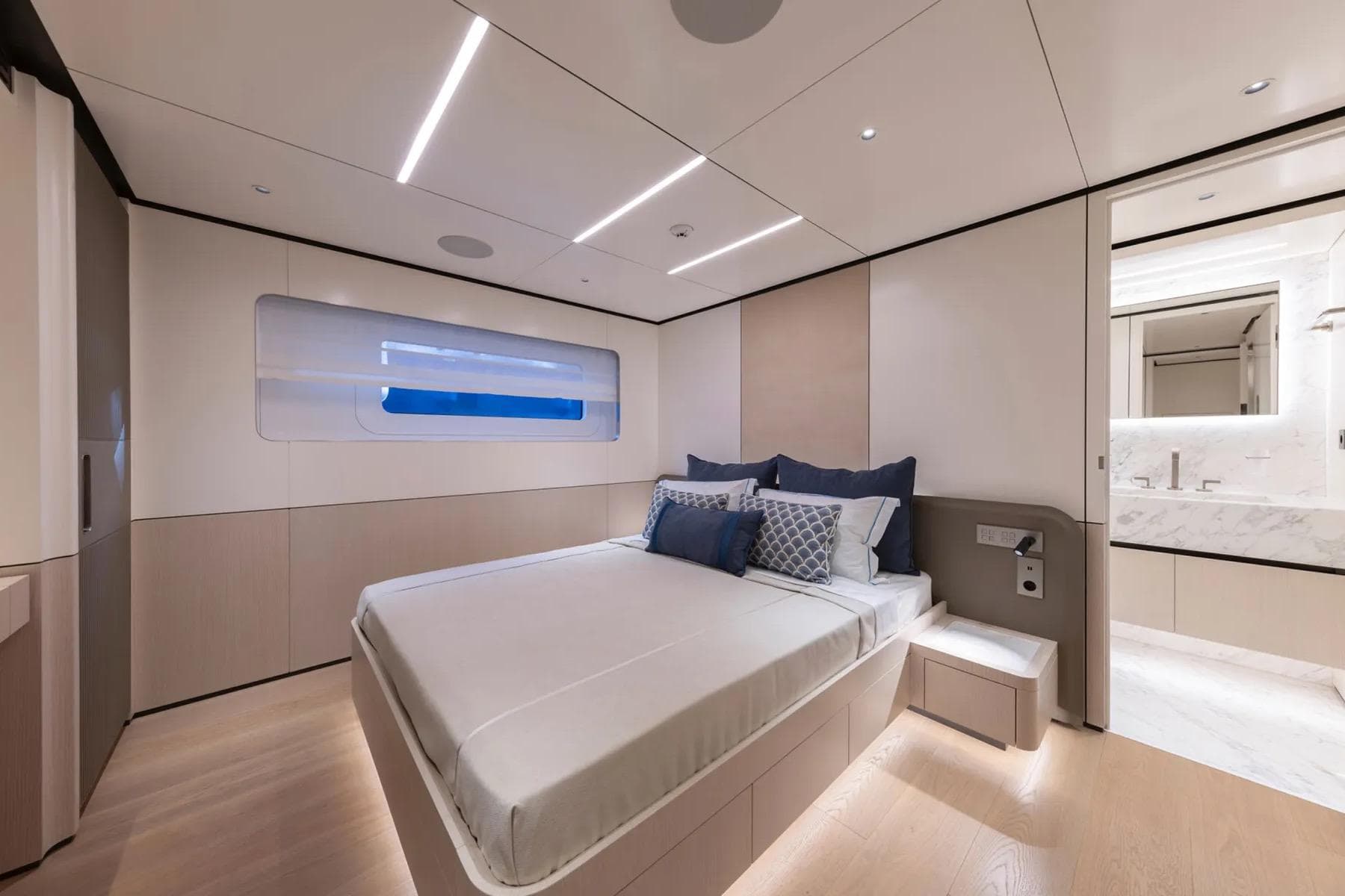 Luxurious bedroom on ART Shipiyard BEE EXPLORER 2025 yacht, featuring modern design and ensuite bathroom.