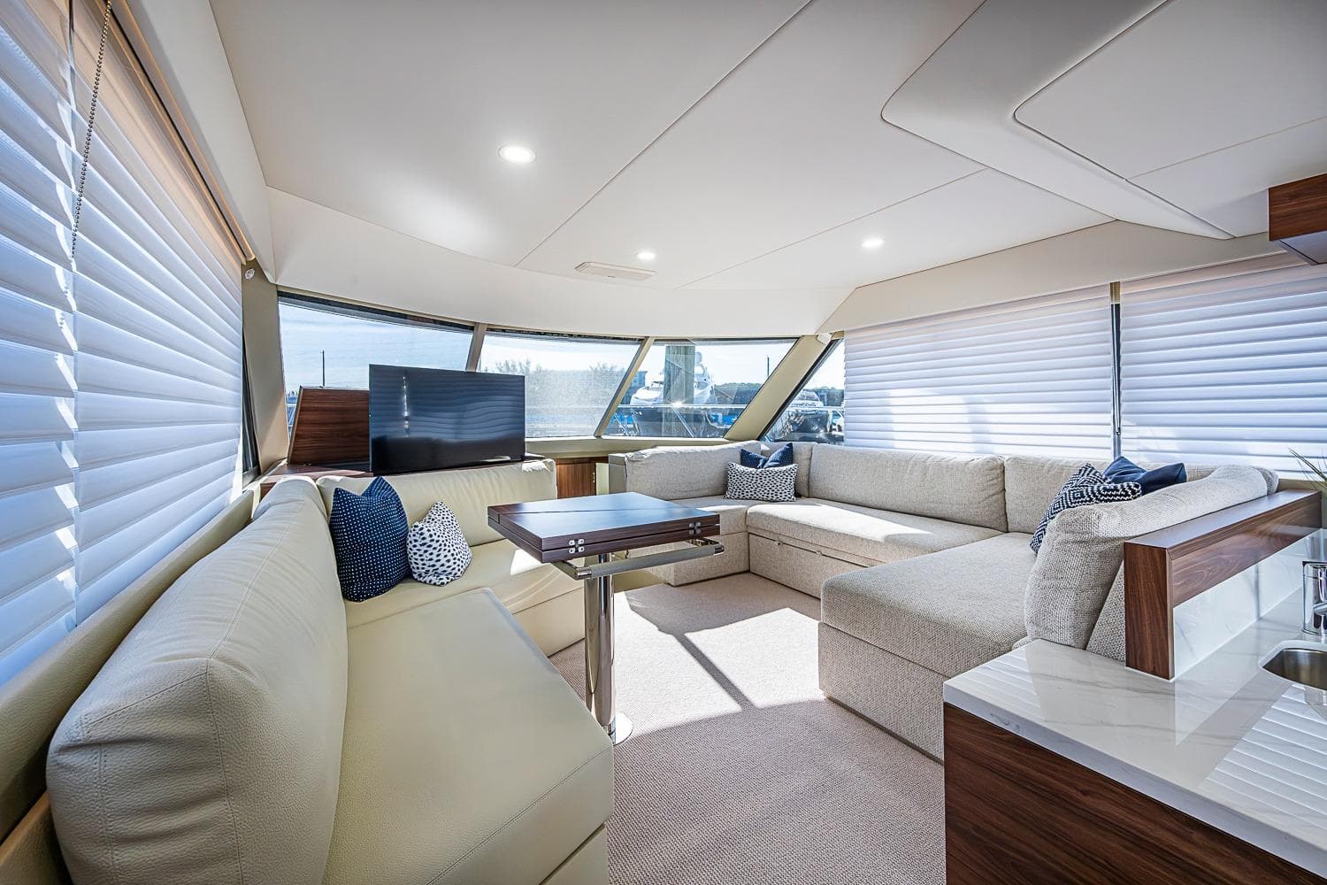 Luxurious interior of 2026 Maritimo M50 yacht with plush seating and modern decor.