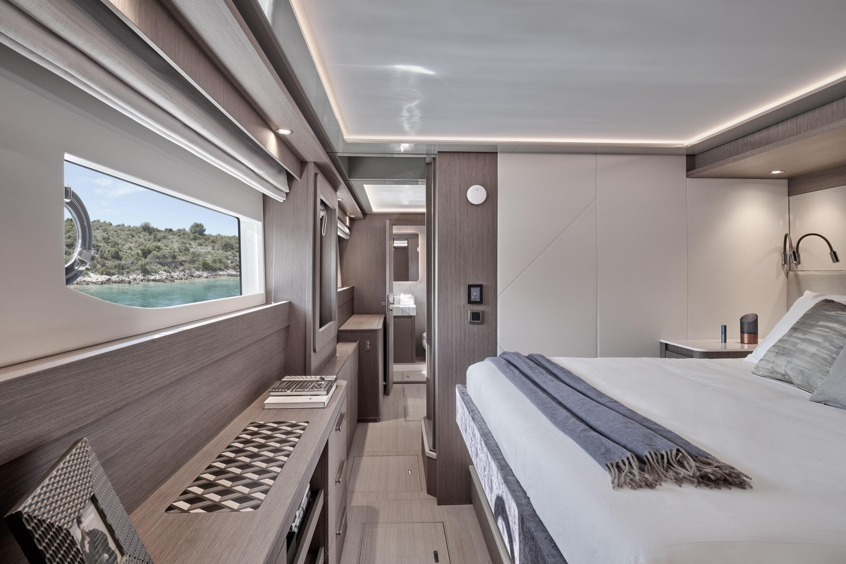 Luxurious interior of 2026 Prestige M8 yacht with modern design and scenic window view.