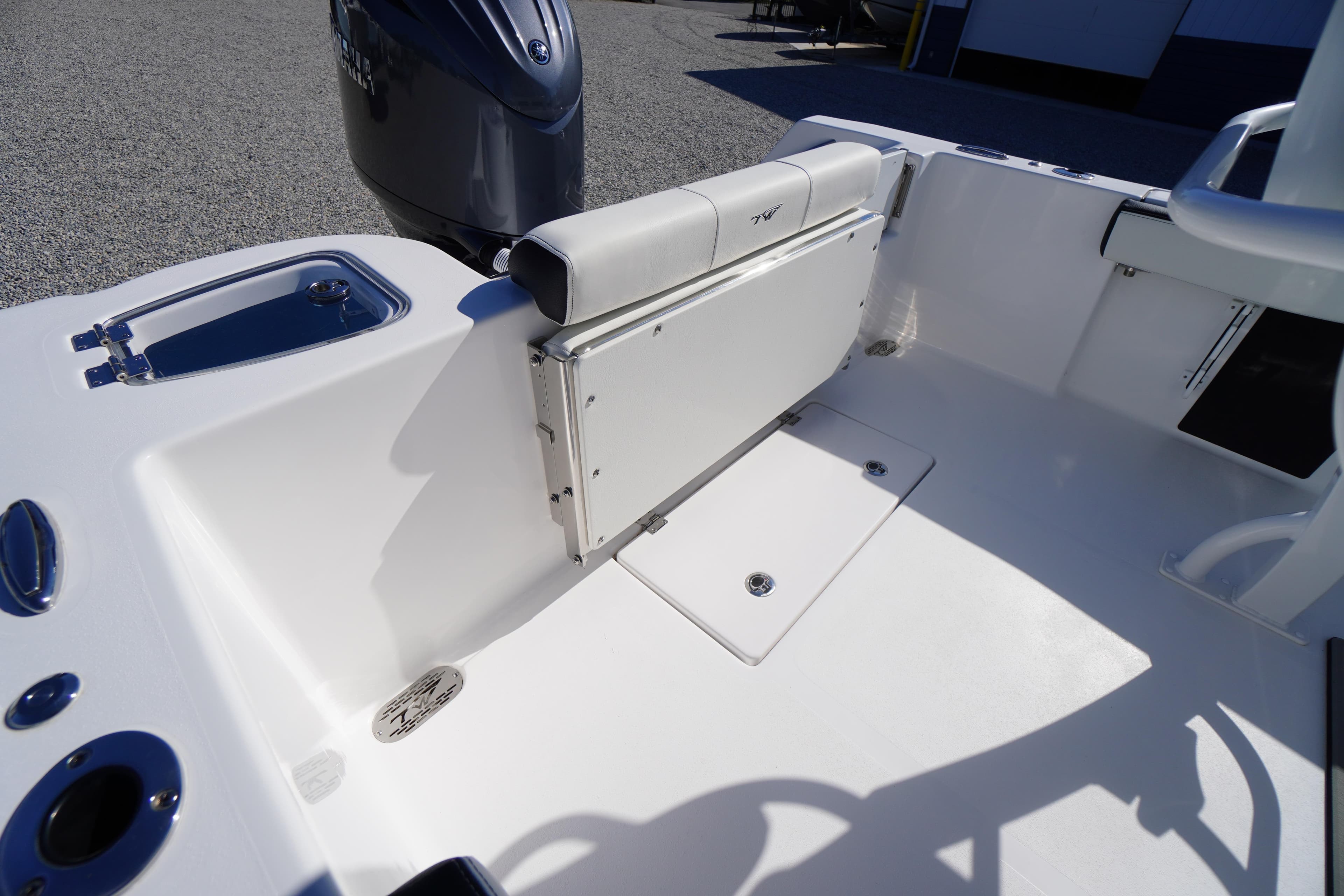 2026 Tidewater 210 CC Adventure boat interior with foldable seating and sleek design.