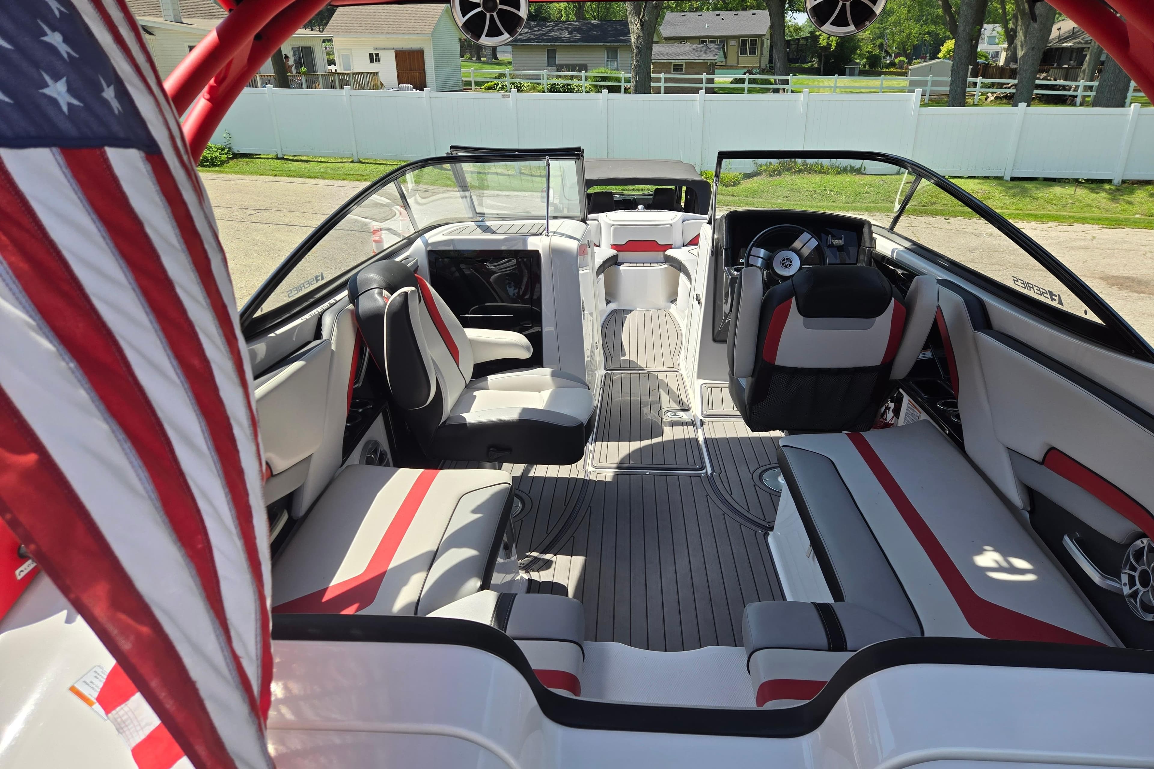 2018 Yamaha Boats 242X interior with red accents and American flag.