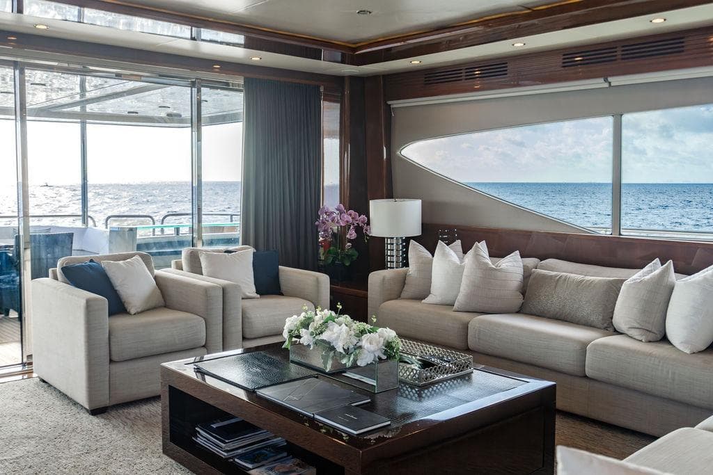 Luxurious interior of 2010 Princess 95 Motor Yacht with ocean view and elegant furnishings.